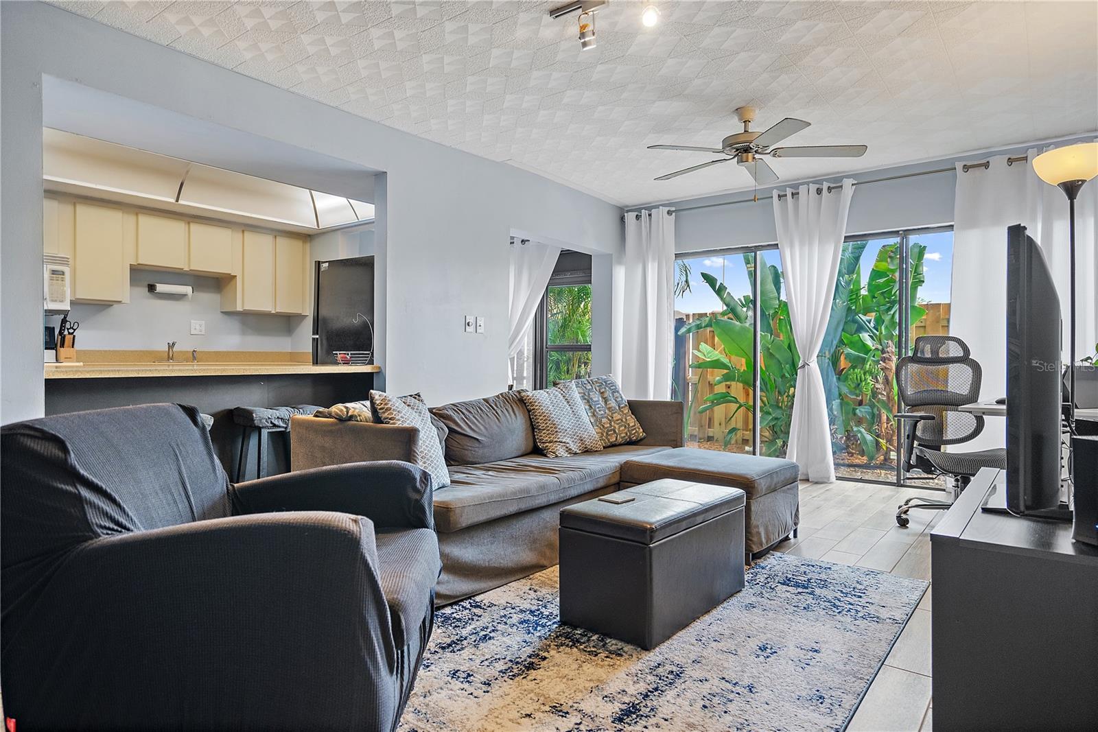 Great natural light pours into this living space with indoor outdoor feel from the wall of sliding doors to your own private courtyard