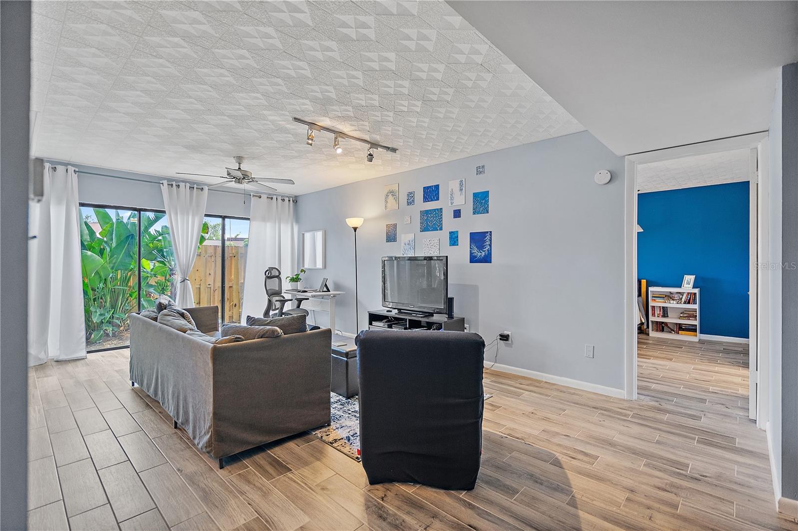 Large, sunny living space with window wall to your own private courtyard