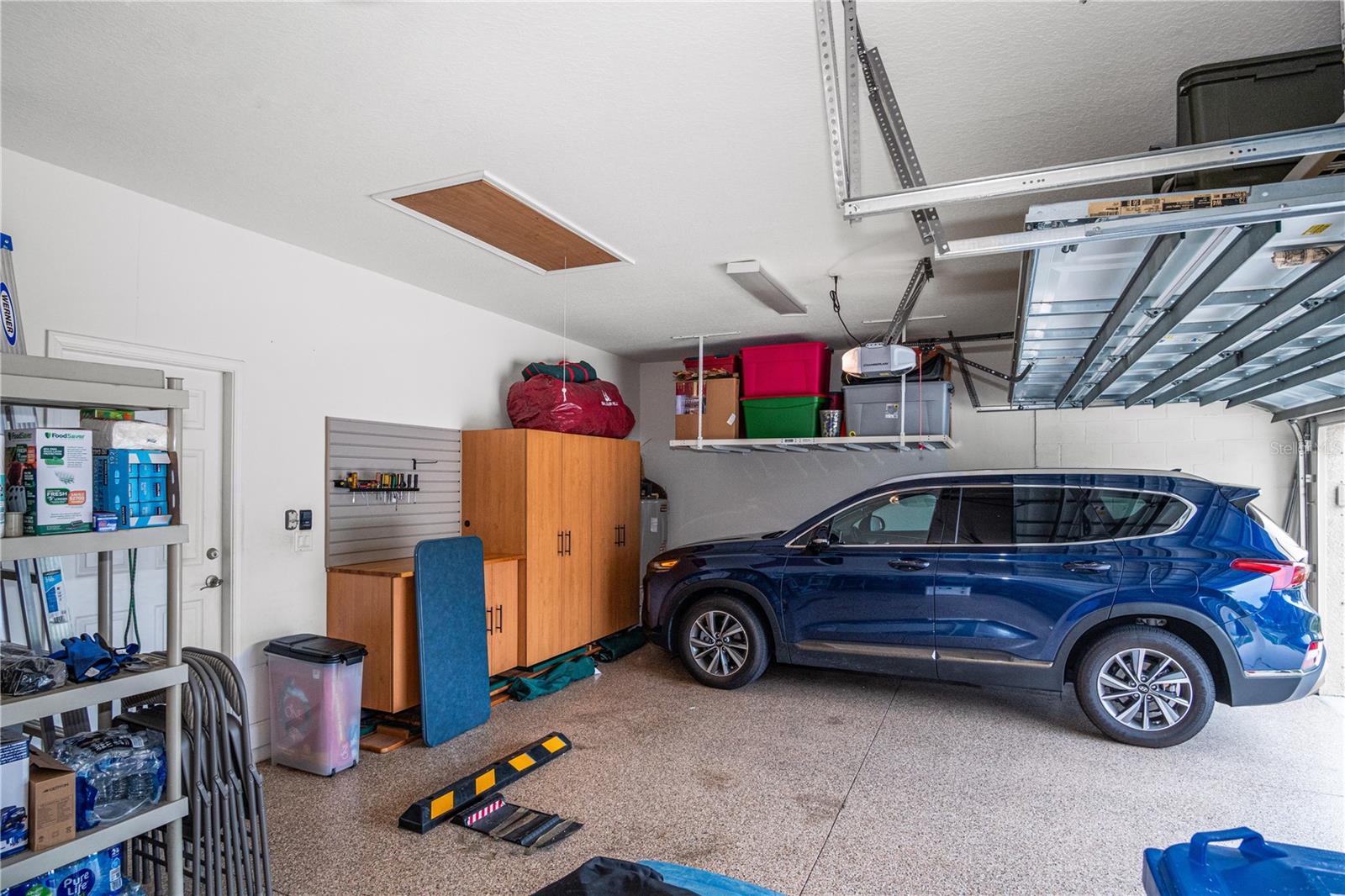 3 Car Garage w/lots ofSSstorage & Pull Down