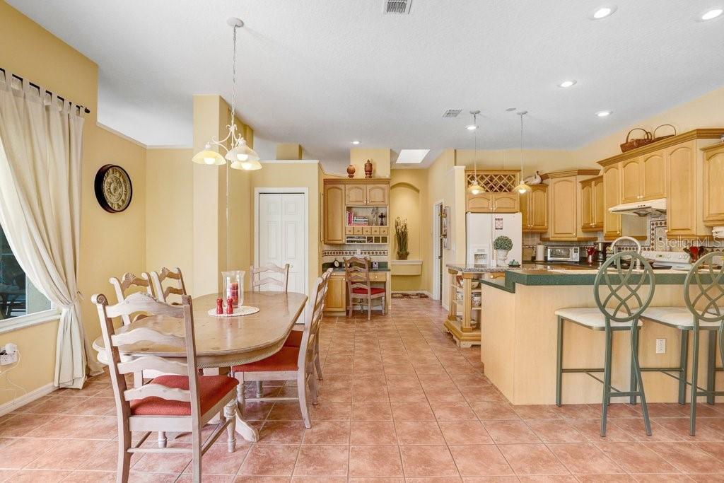 Eat-in kitchen nook with sliding doors to the pool deck