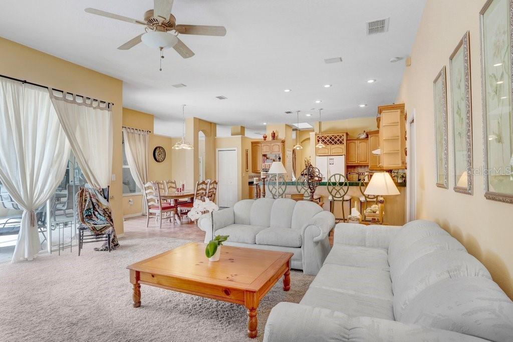 family room with sliding doors to pool deck