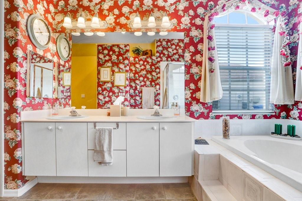 Dual sink vanities with large windows for natural lighting