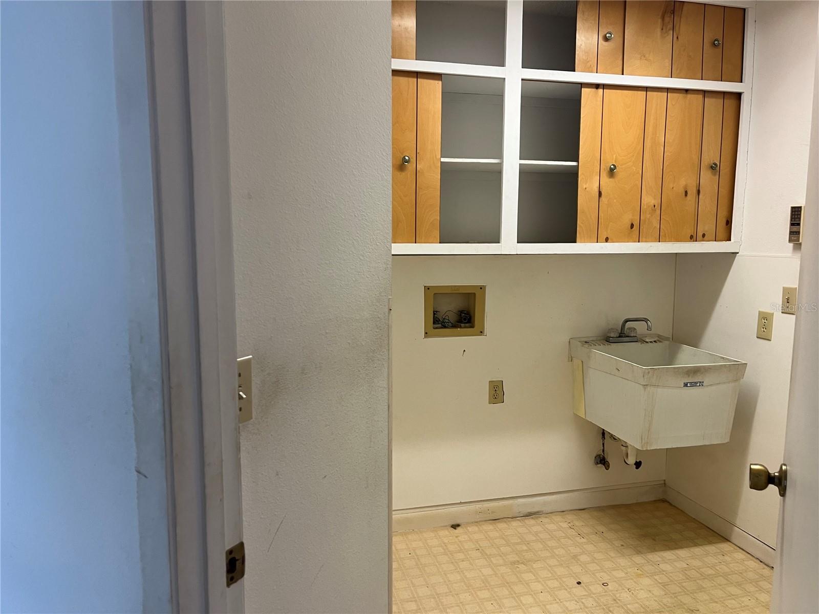 Laundry Room with washer and dryer hook ups