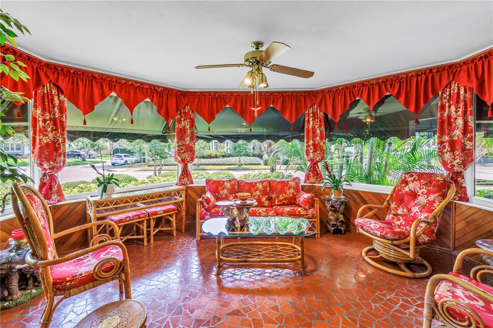 Florida room with mosaic tile and bay window.
