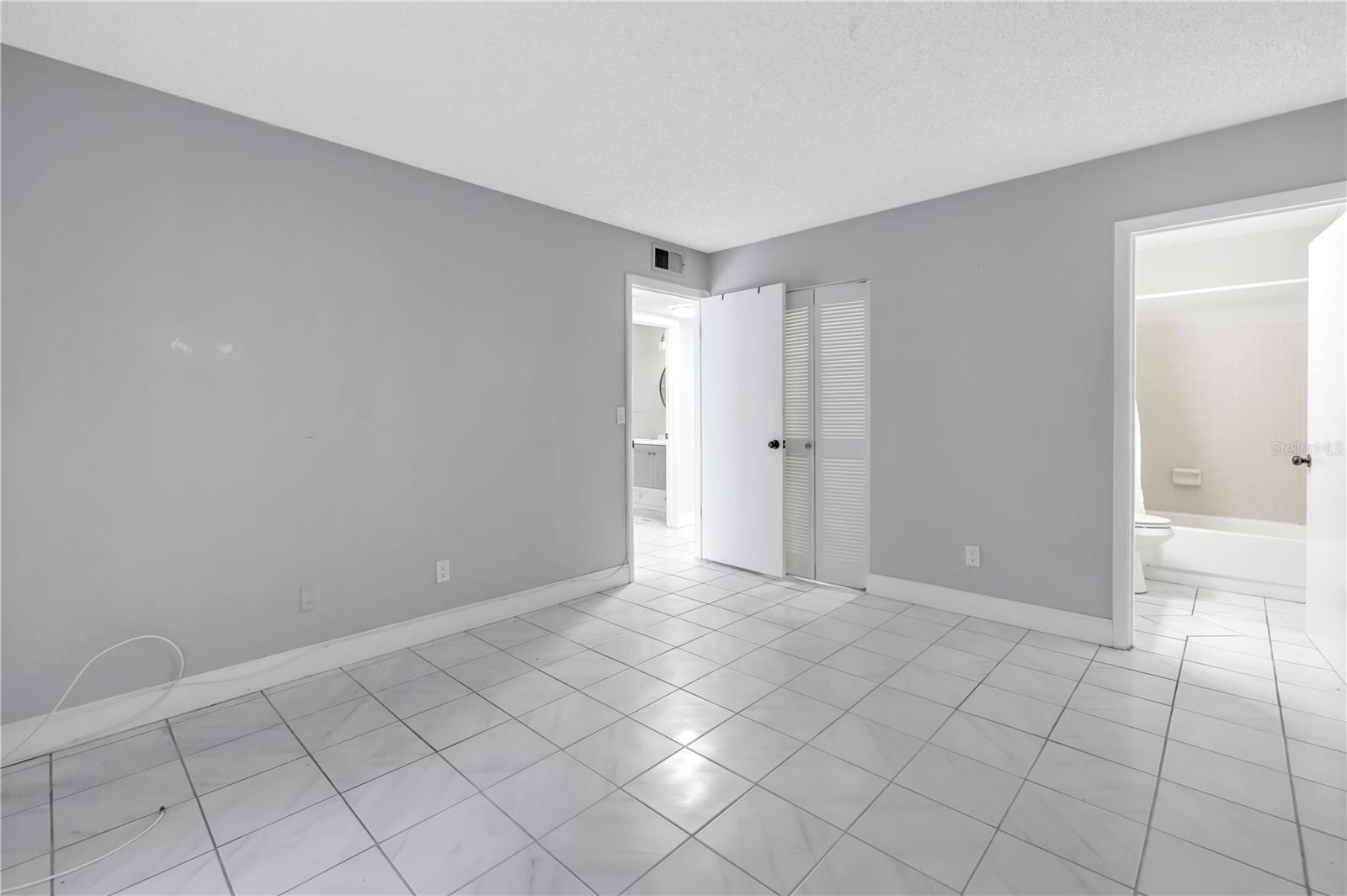 primary bedroom and bath