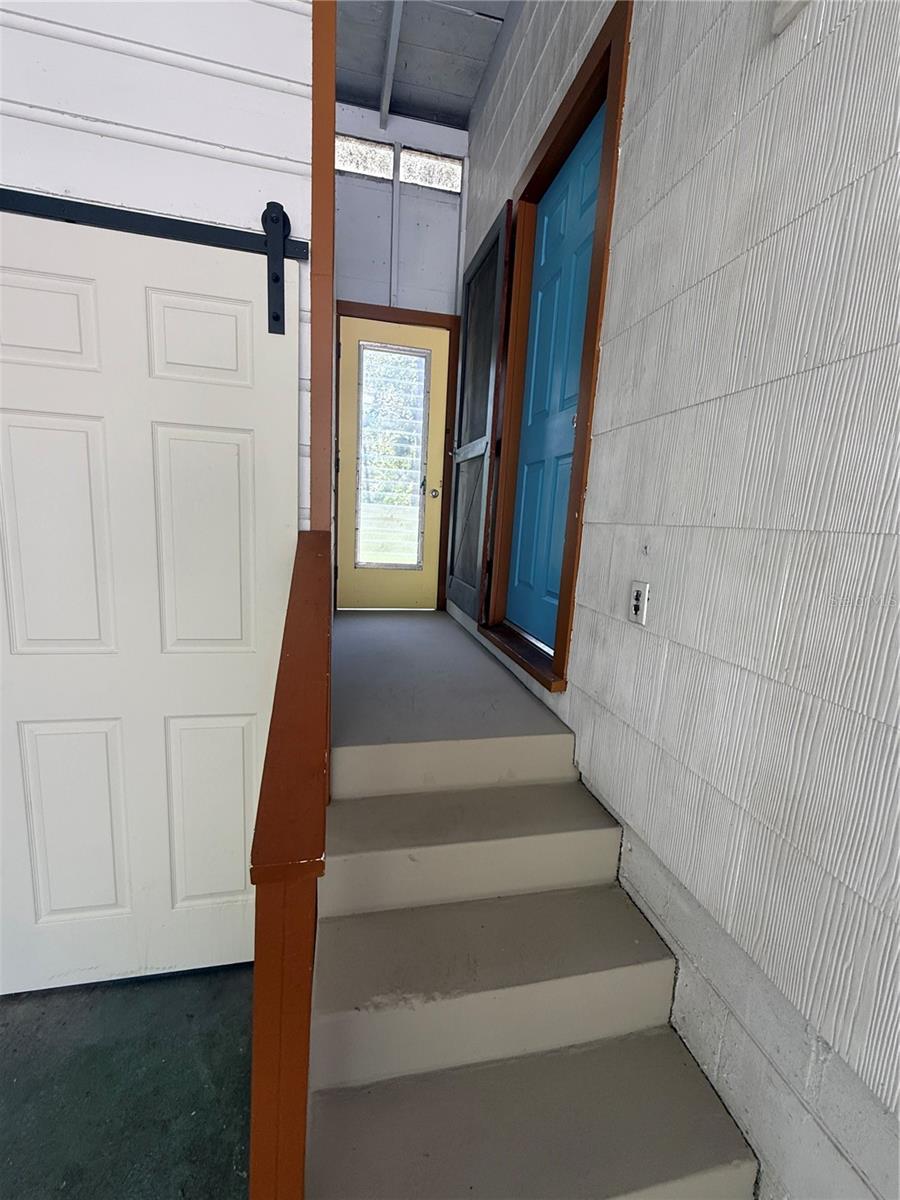 Stairs to rear door 708