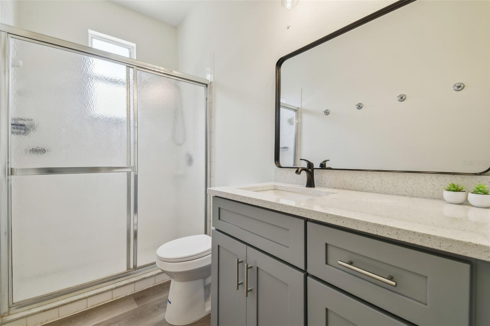 Primary Ensuite Bathroom with door