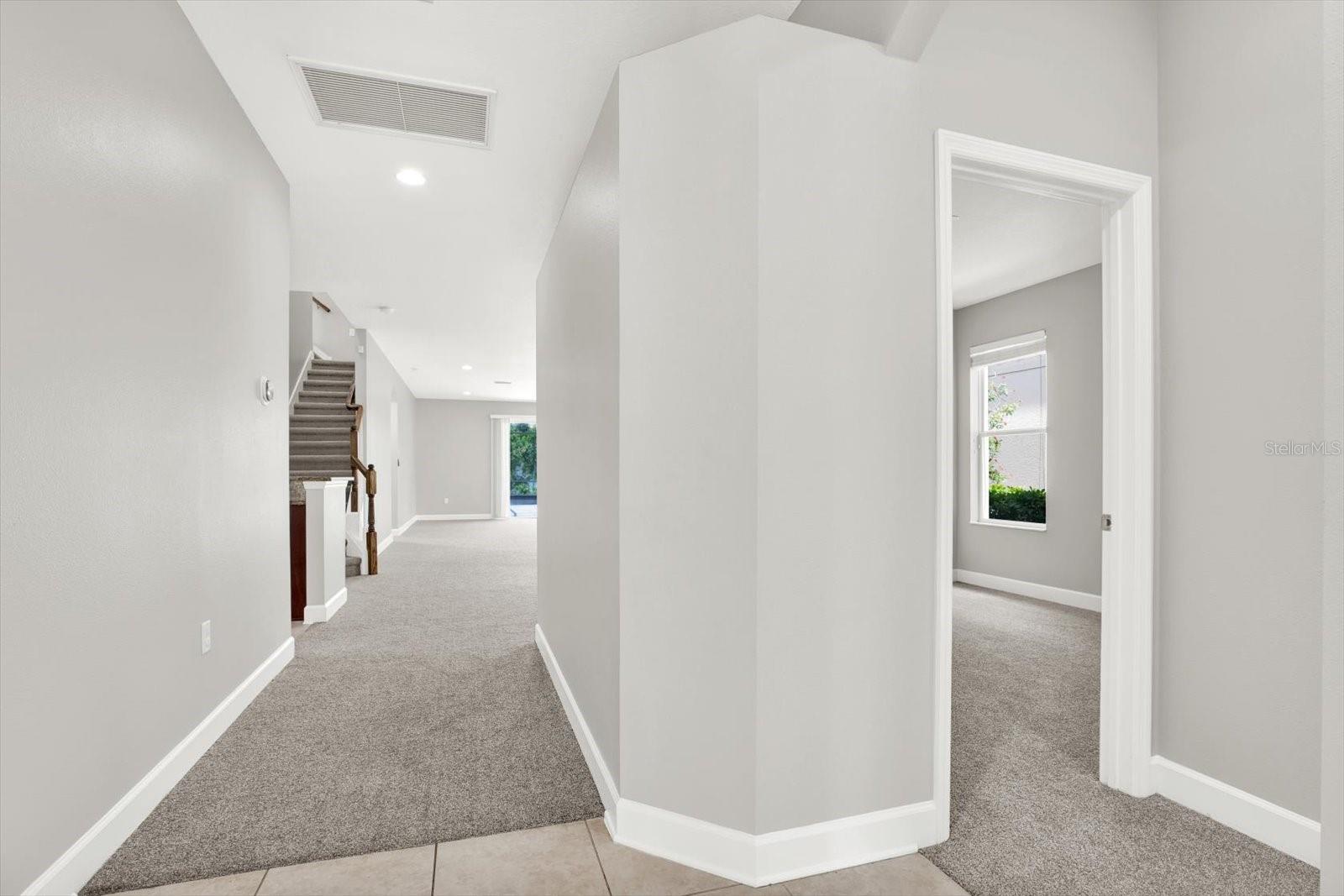 Walking in, there are 2 bedrooms and a bathroom on the right