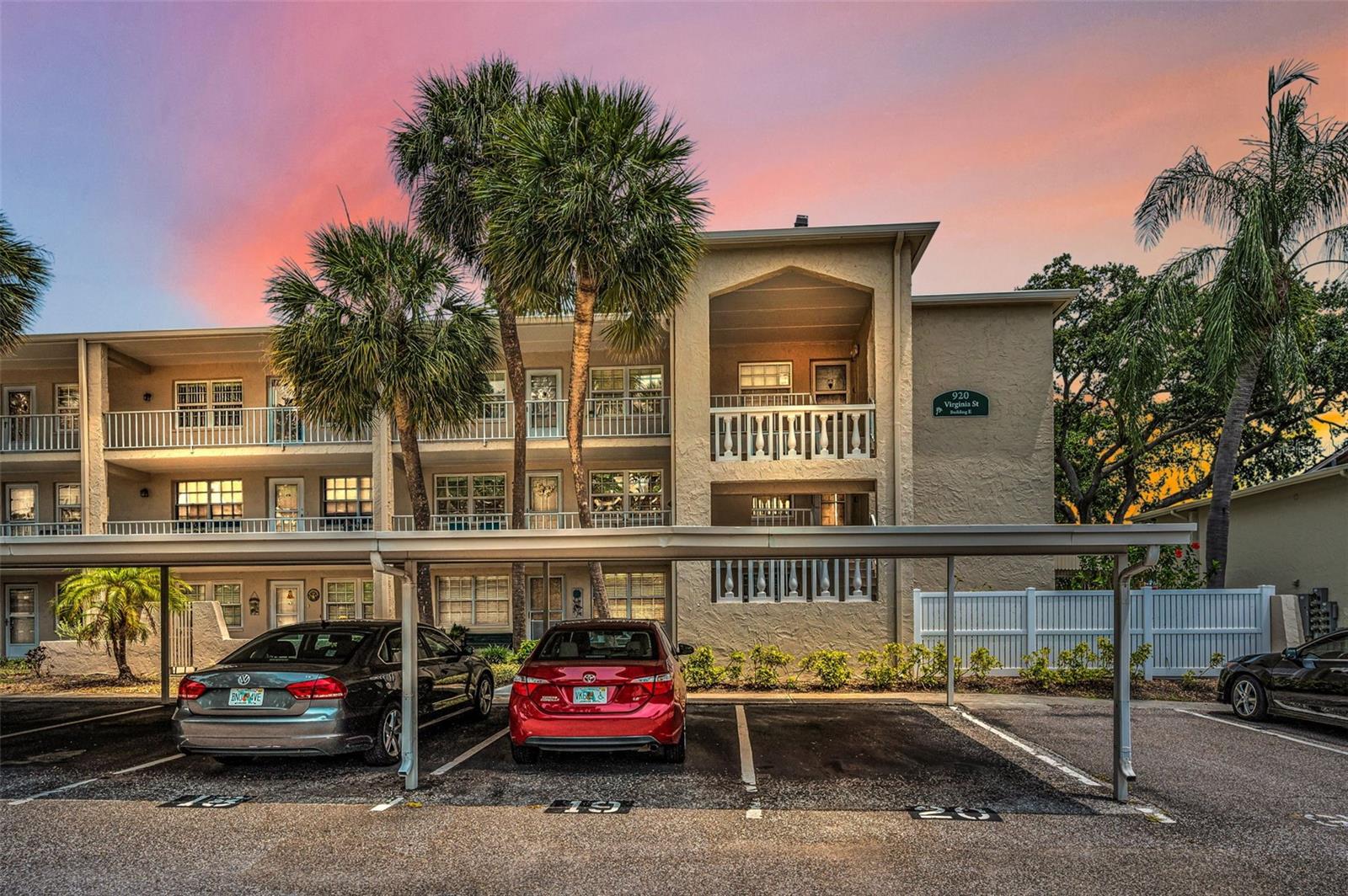 Welcome Home to 920 Virginia Street #109.  Your condo is the first floor, corner unit with the side yard behind the white fence to the right.
