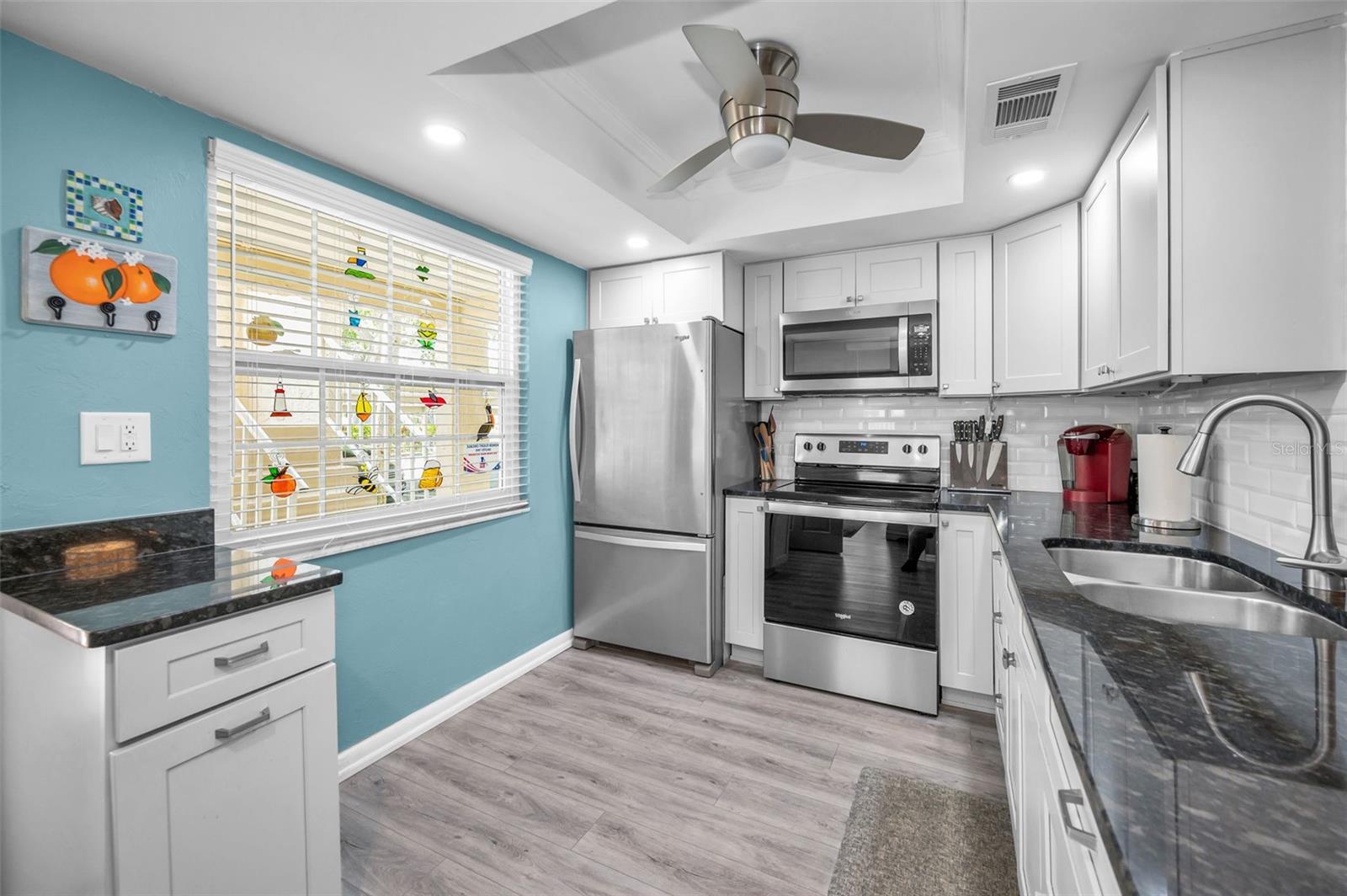 WHAT A JEWEL OF A KITCHEN!  SPARKLING NEW STAINLESS STEEL APPLIANCES AND GRANITE COUNTERTOPS!