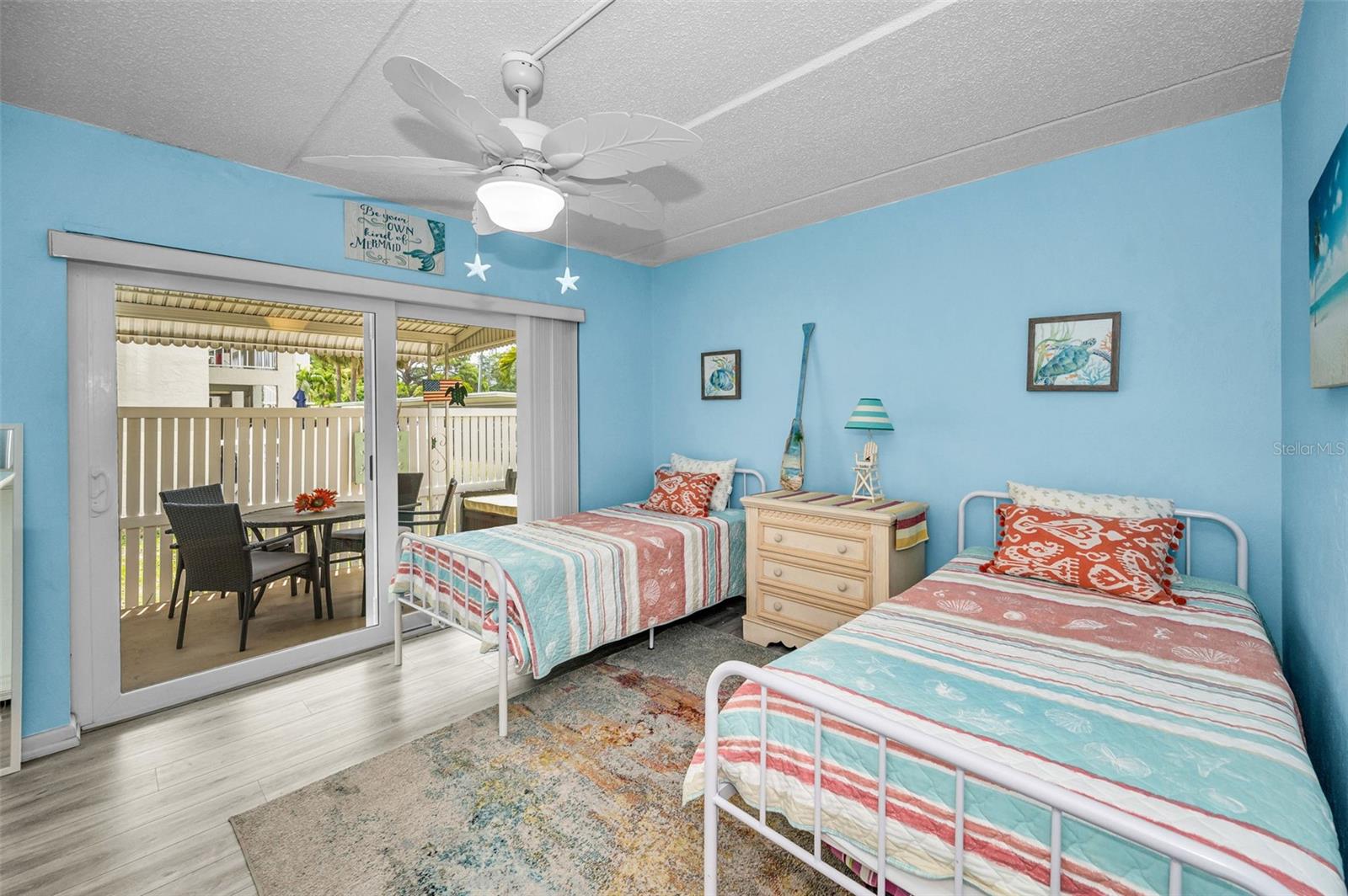 Front Bedroom with Impact sliders to covered side patio and corner yard.
