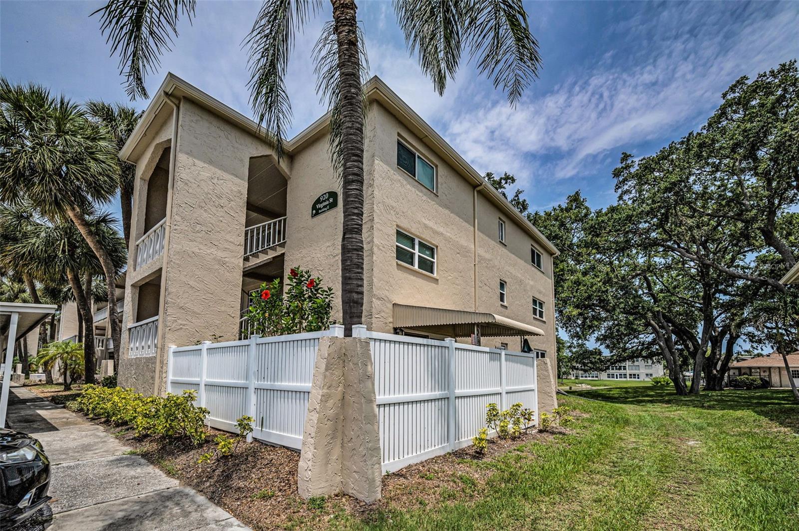Room to move!  Behind the white fence is your covered and open air patio!
