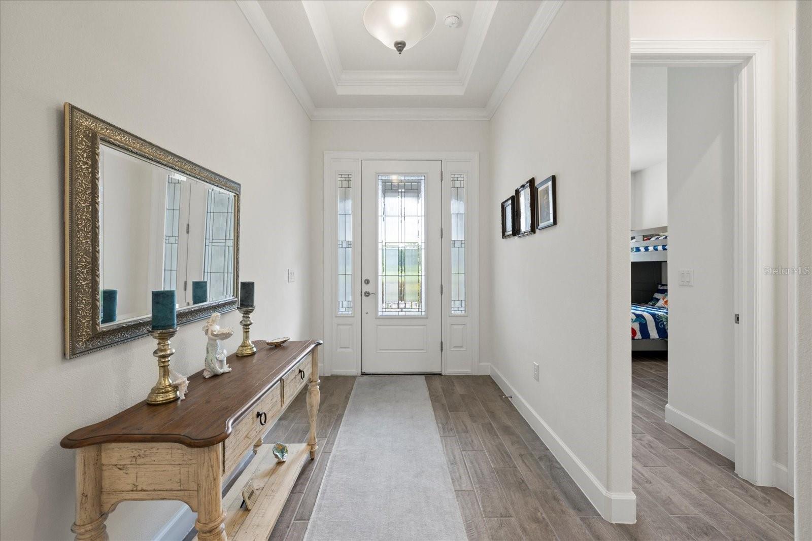 Front entry view into first bedroom