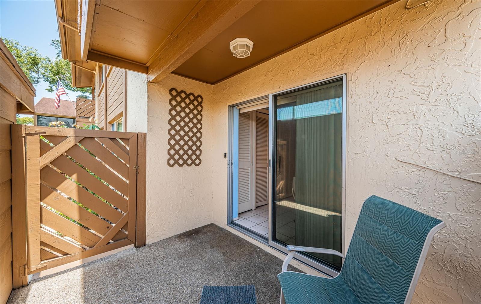 Front Lanai - Gate to Carport - Sliders to Kitchen