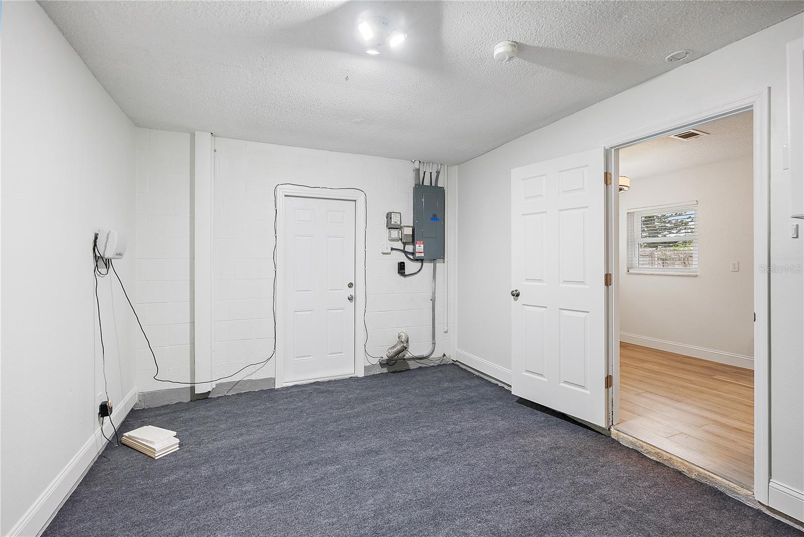 Indoor laundry room/ washer and dryer/pantry room of the kitchen