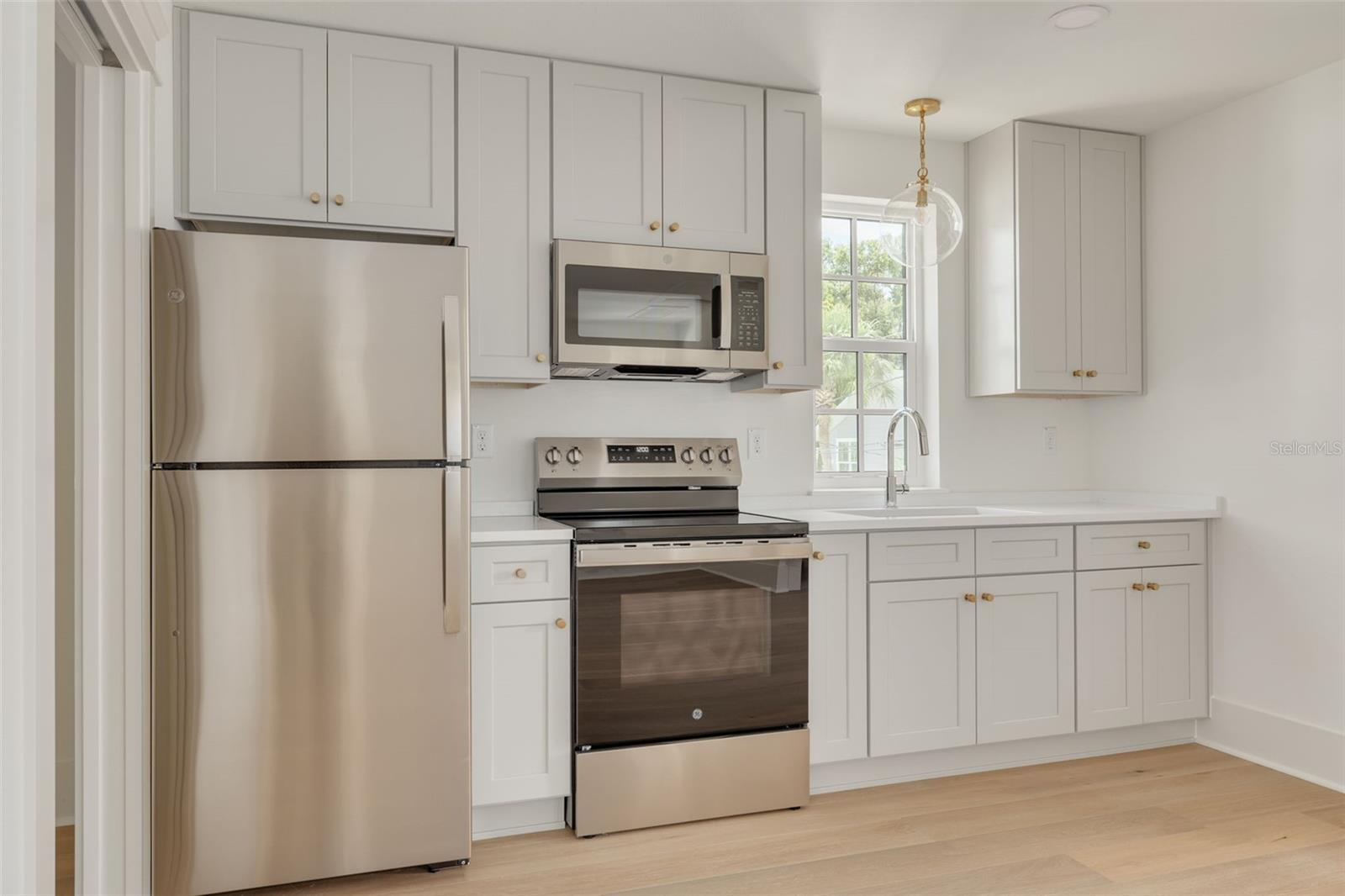 Representative kitchen in the ADU. This photo is a different model, similar finishes will be provided.