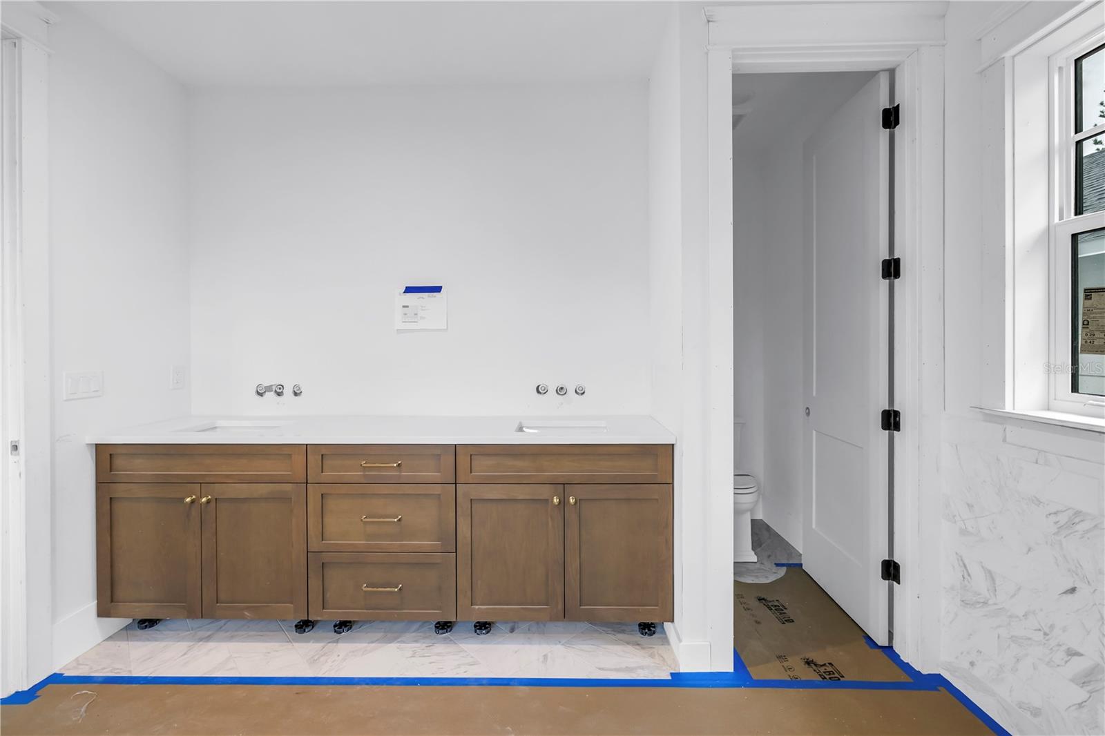 Main bath vanity & water closet