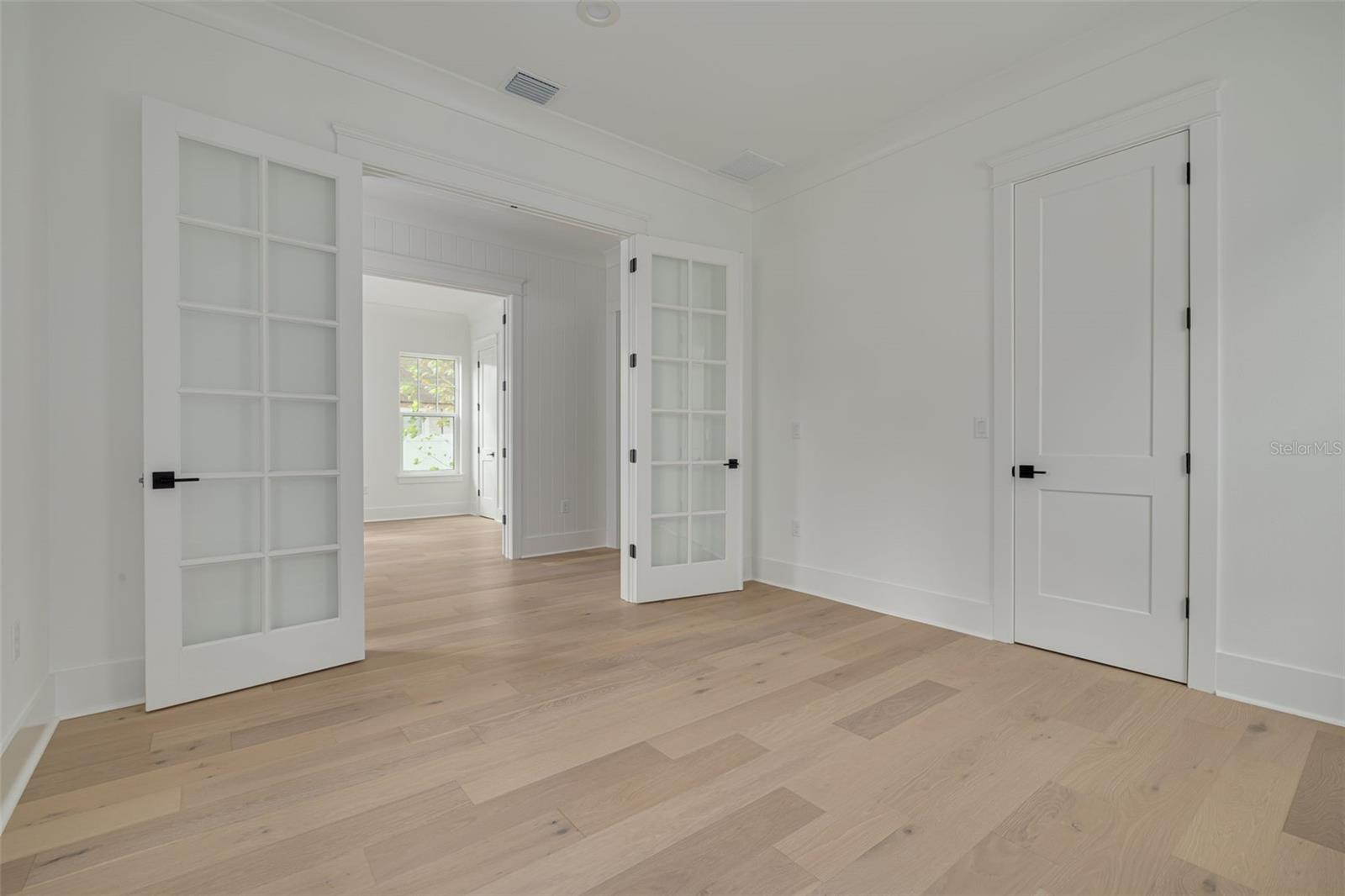 Engineered hardwood flooring throughout - this is a representative sample of the first floor den/4th bedroom. This photo is a different model, similar finishes will be provided