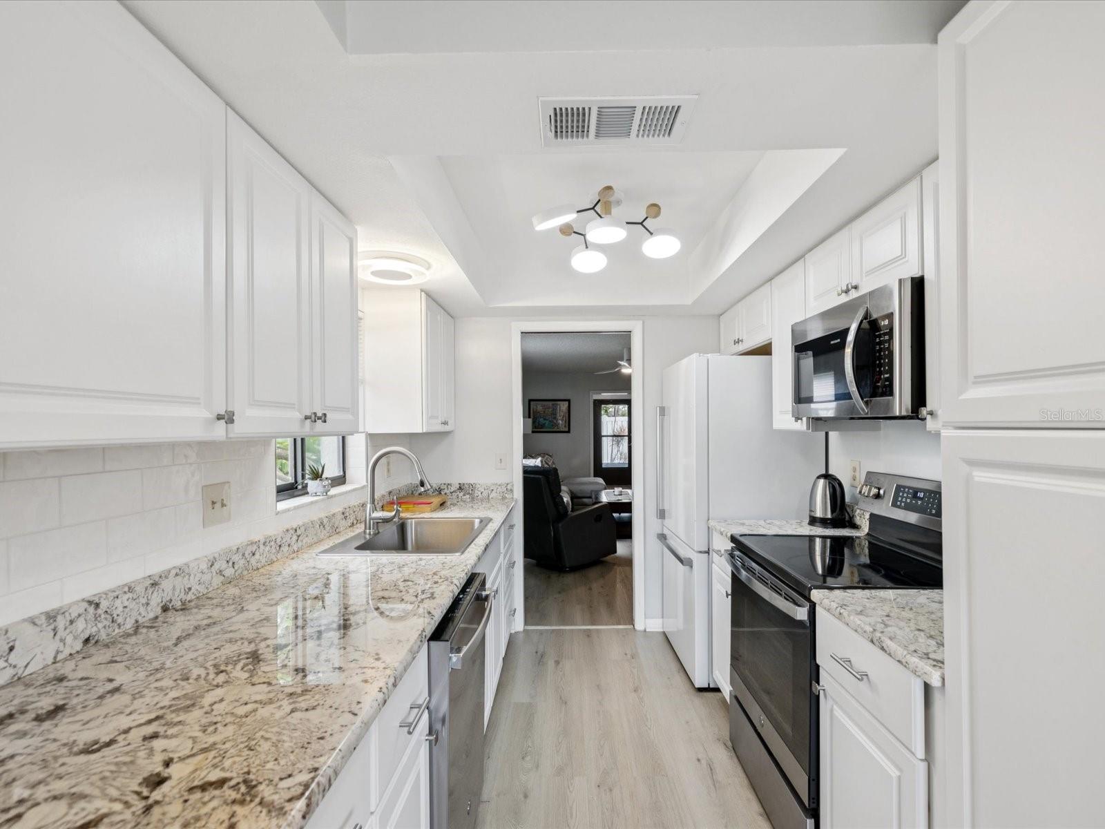 Bright, White Cabinets, Granite Counters