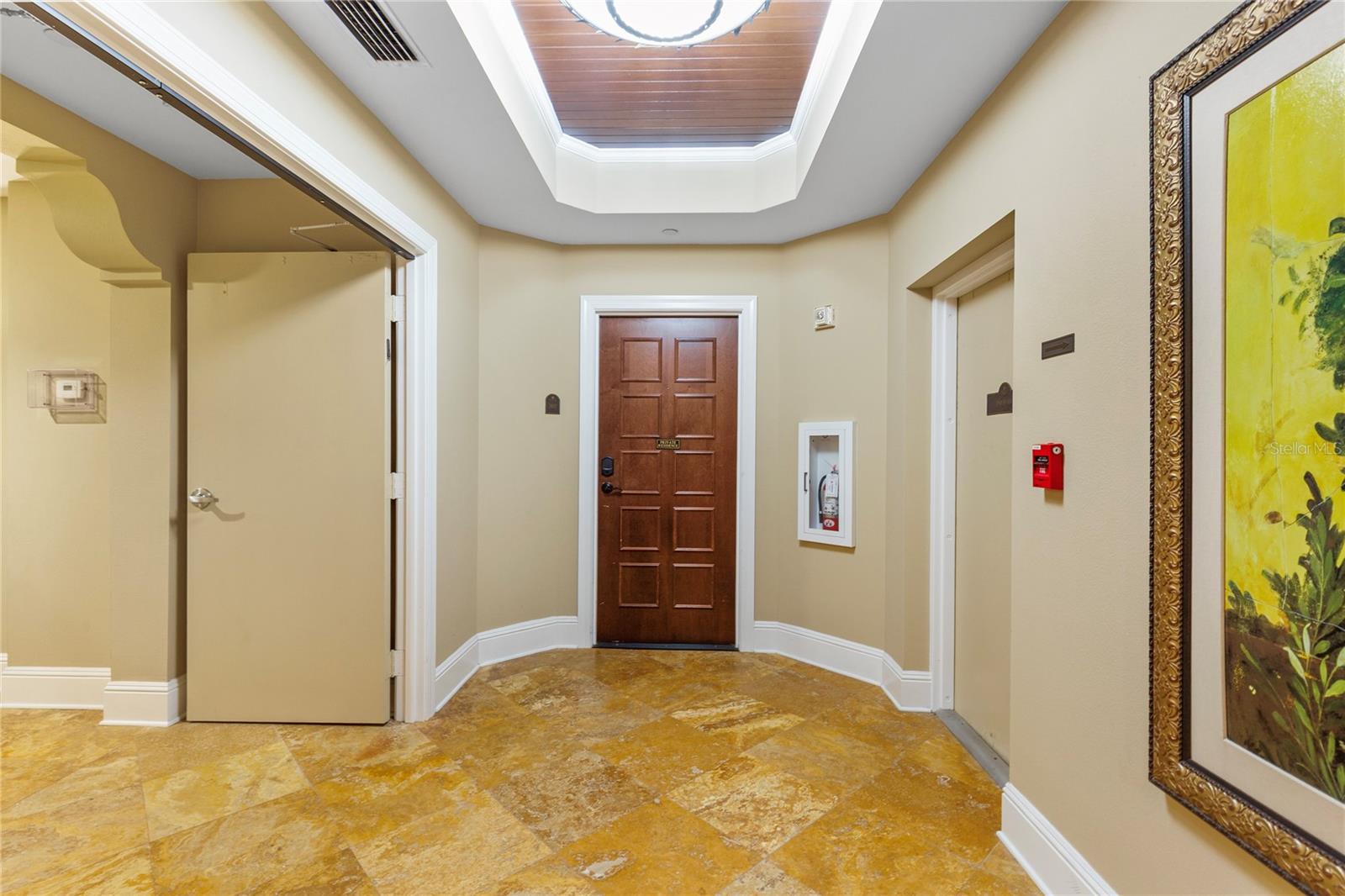 This is the entry door from the main hallway off of the elevators.