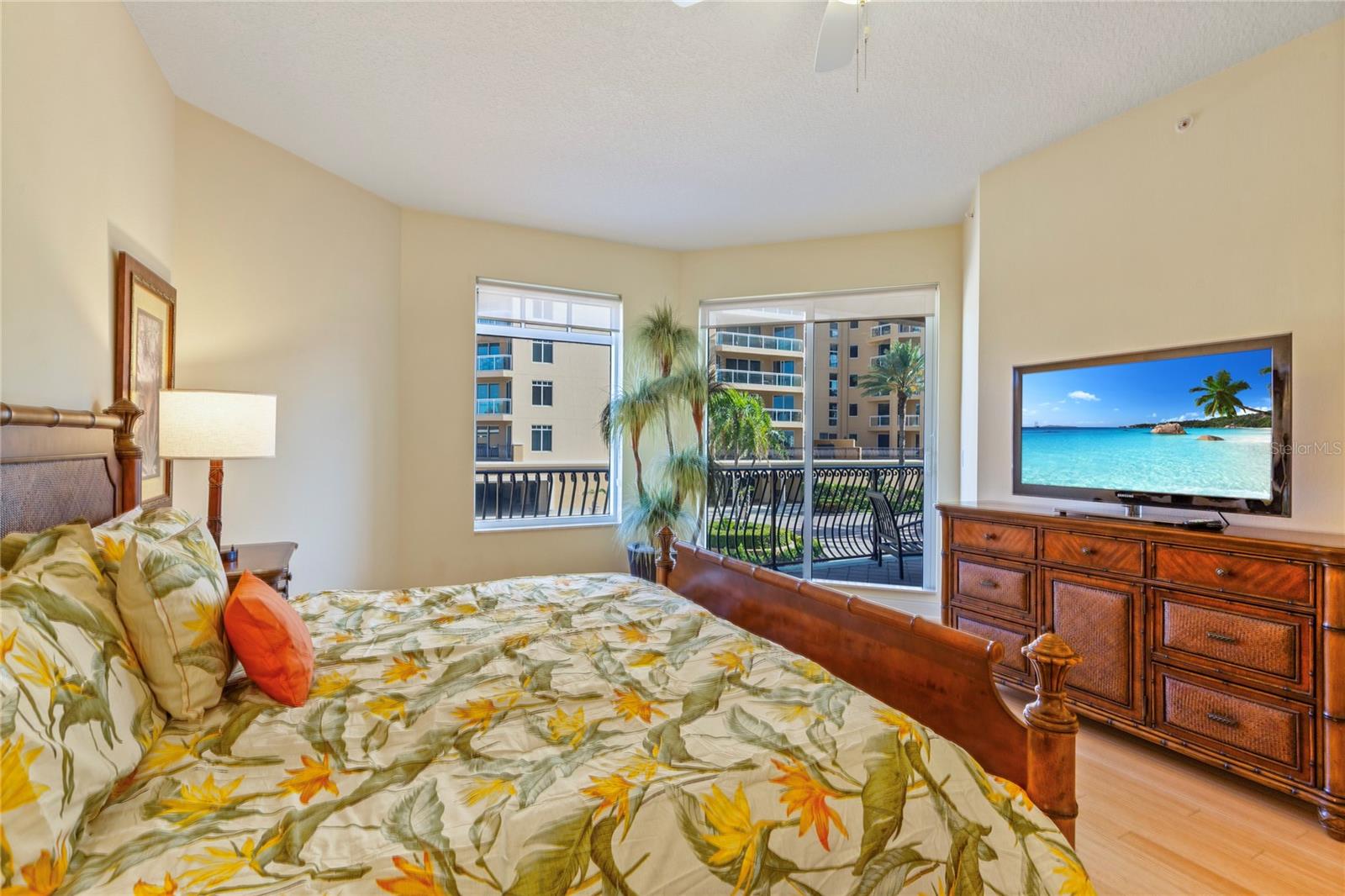 Primary bedroom with balcony access.