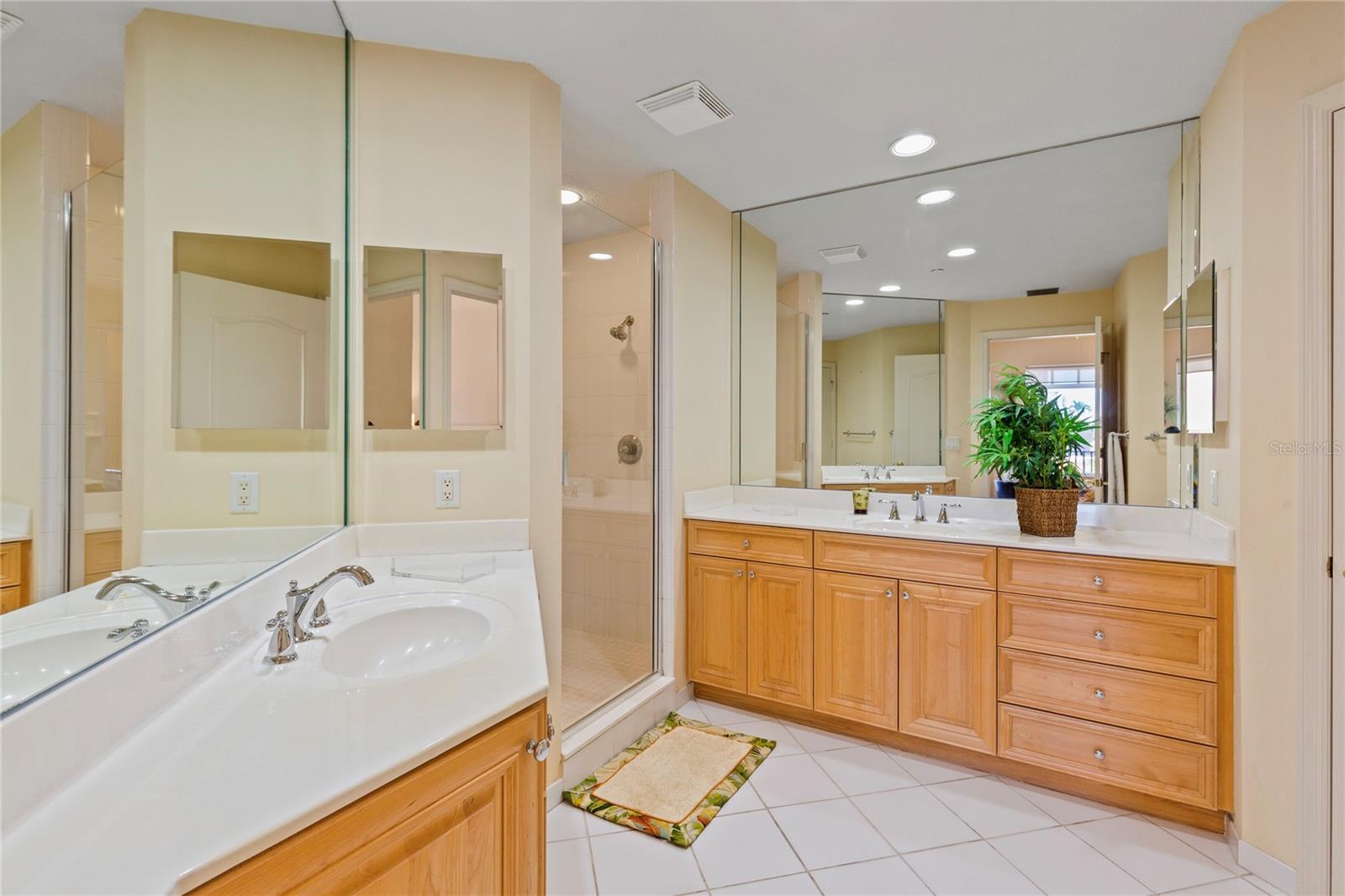 Two separate vanities, a water closet and a walk in shower complete the bath.