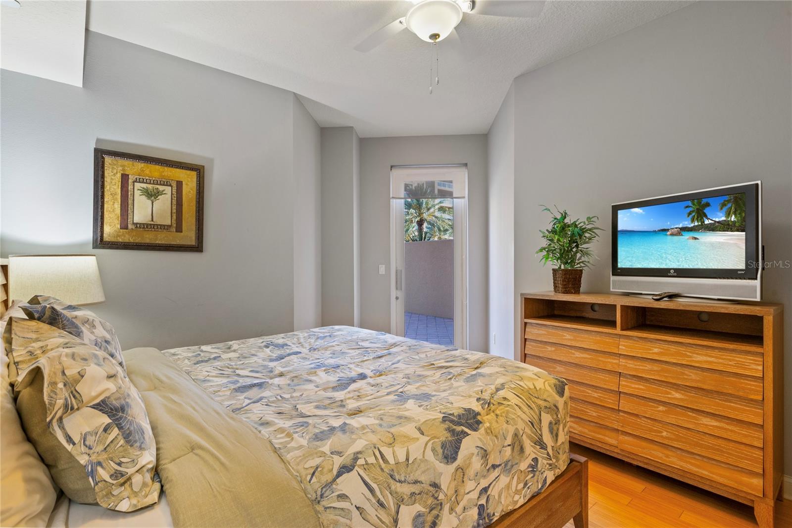 The guest bedrooms are on the other side of the home from the primary.  This one also features a king-sized bed and access to the balcony to sip your morning coffee and watch the sun rise.