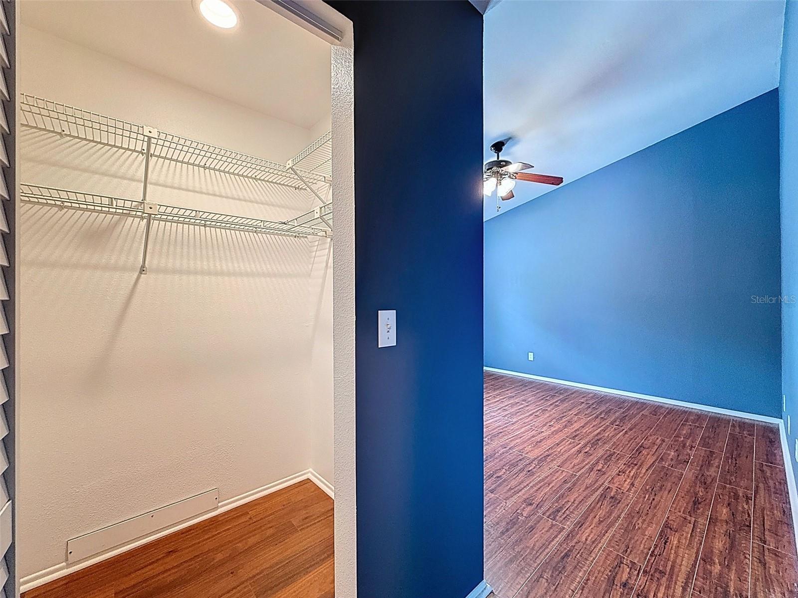 Primary bedroom walk in closet