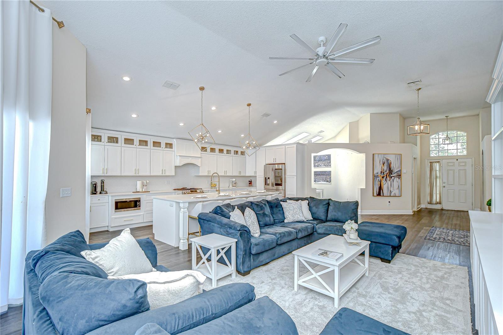 These soaring ceilings paired with tasteful updates creates the perfect home!