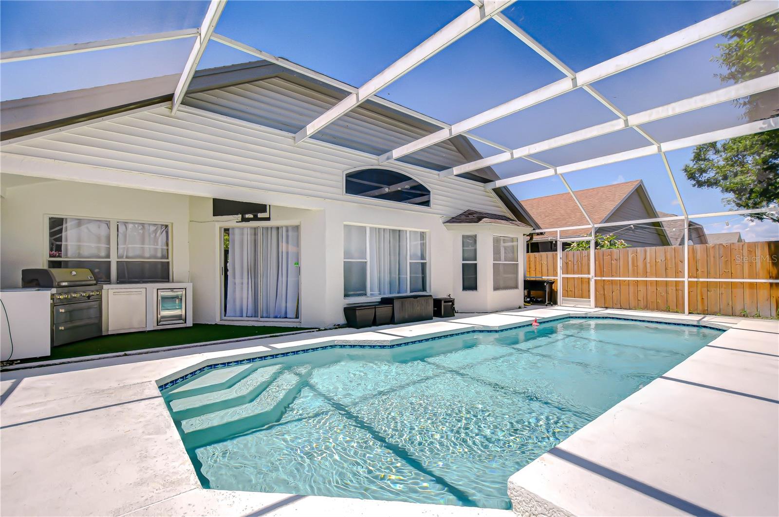 Take a dip in the sparkling pool in the screened lanai!