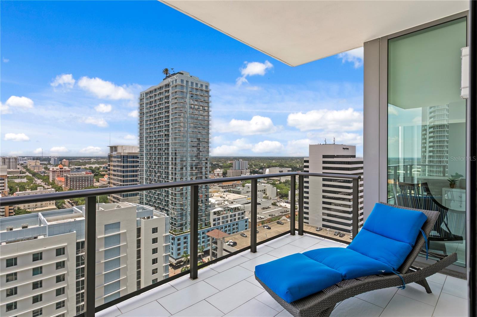 spacious balcony overlooking city and sunsets