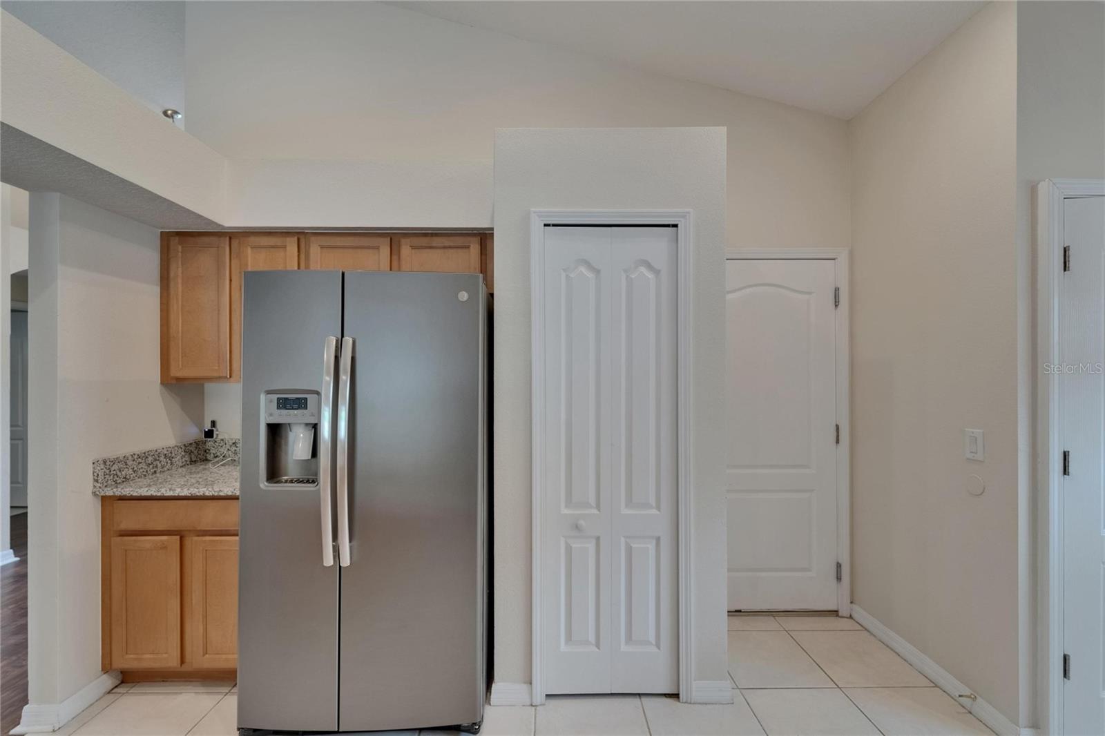 closet pantry and door to garage