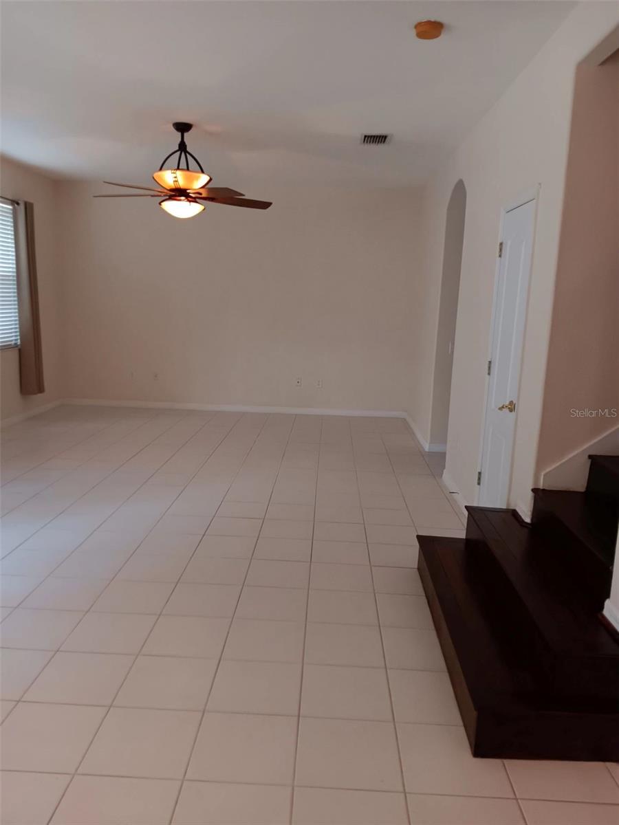 family rm with porcelain tile and gorgeous fan