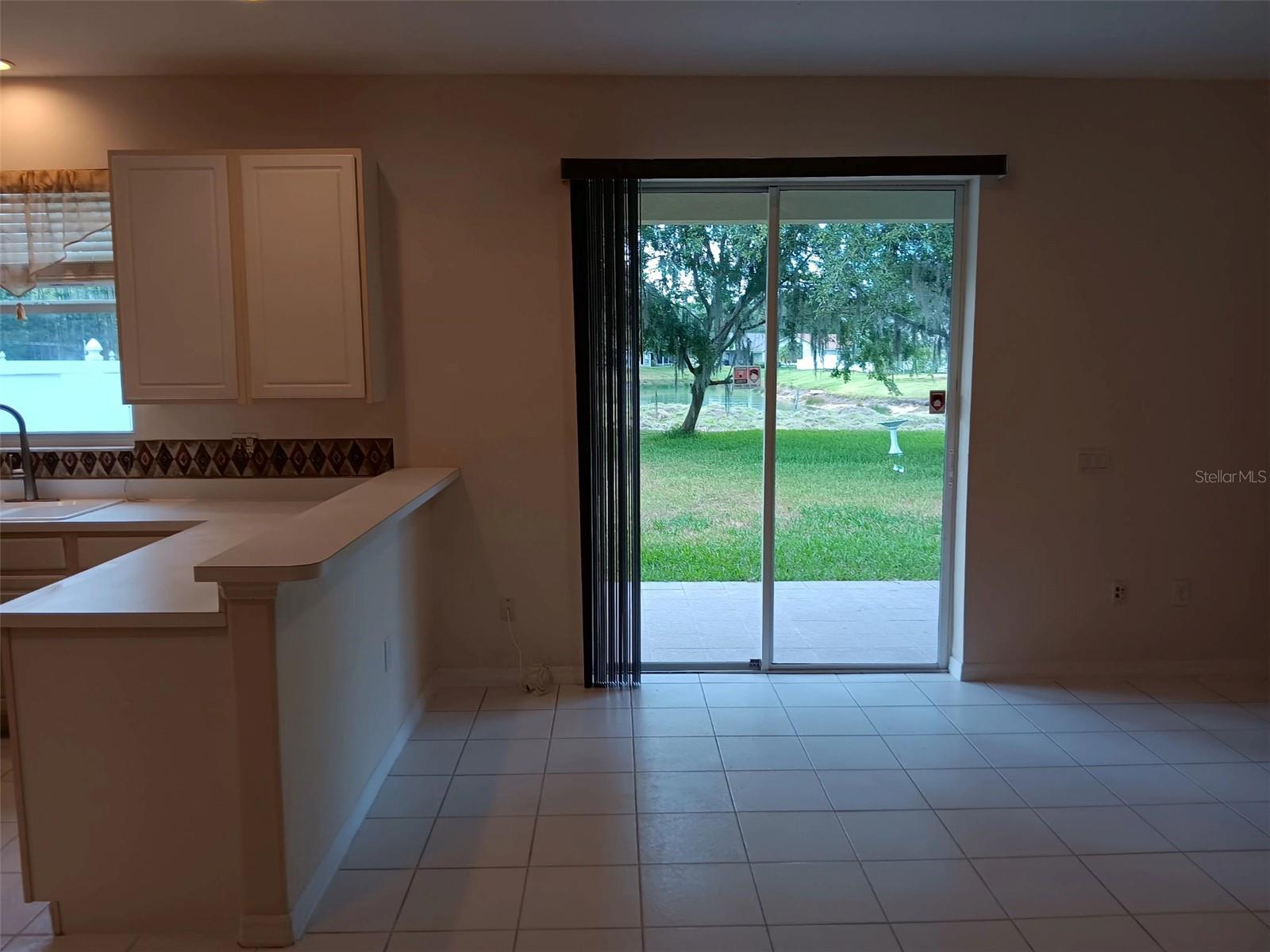so high slide door to overlook pond view