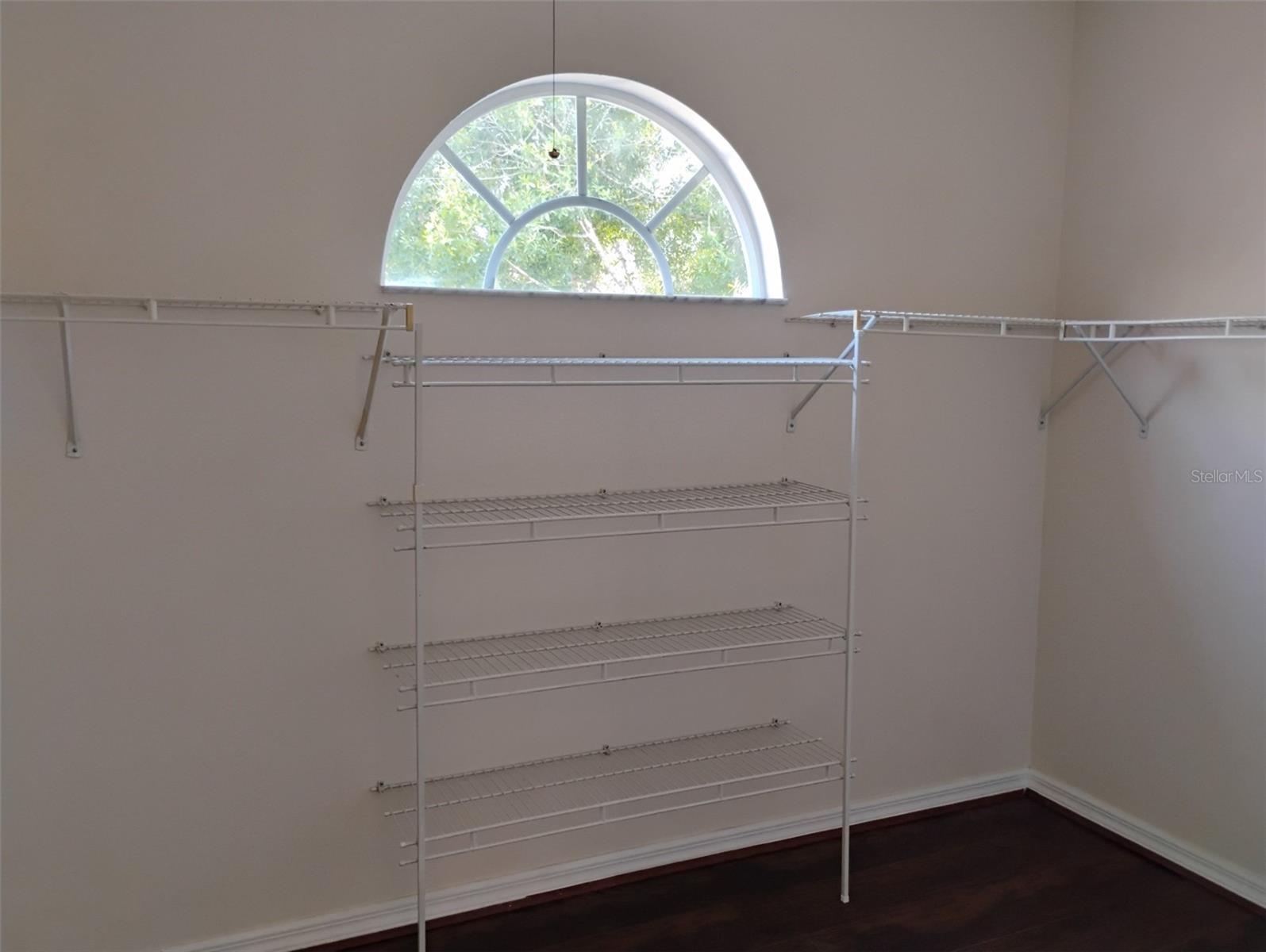 2 walking closets of hers in master suite