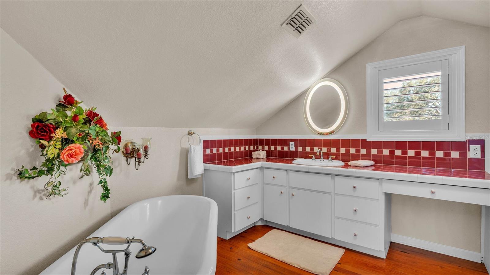 Ensuite bathroom with a classic elegant clawfoot soaking tub, beautifully preserved and perfect for long, relaxing baths.