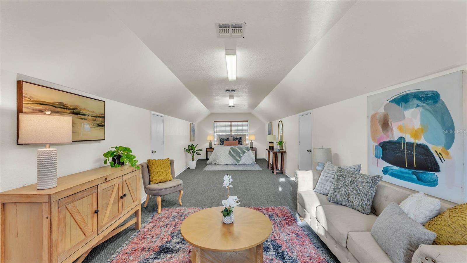 The substantial detached concrete block garage complete with an independent apartment—ideal for extended family, home based business, or rental potential. The building is huge and has two 12 foot garage doors, full electrical, plumbing, concrete slab floor, a metal roof, and is on its own electric meter. The spacious 12 x 36 bedroom suite is upstairs and spans the full length of the garage. Downstairs is a nice bathroom with a shower. There is also a washing machine hook-up.