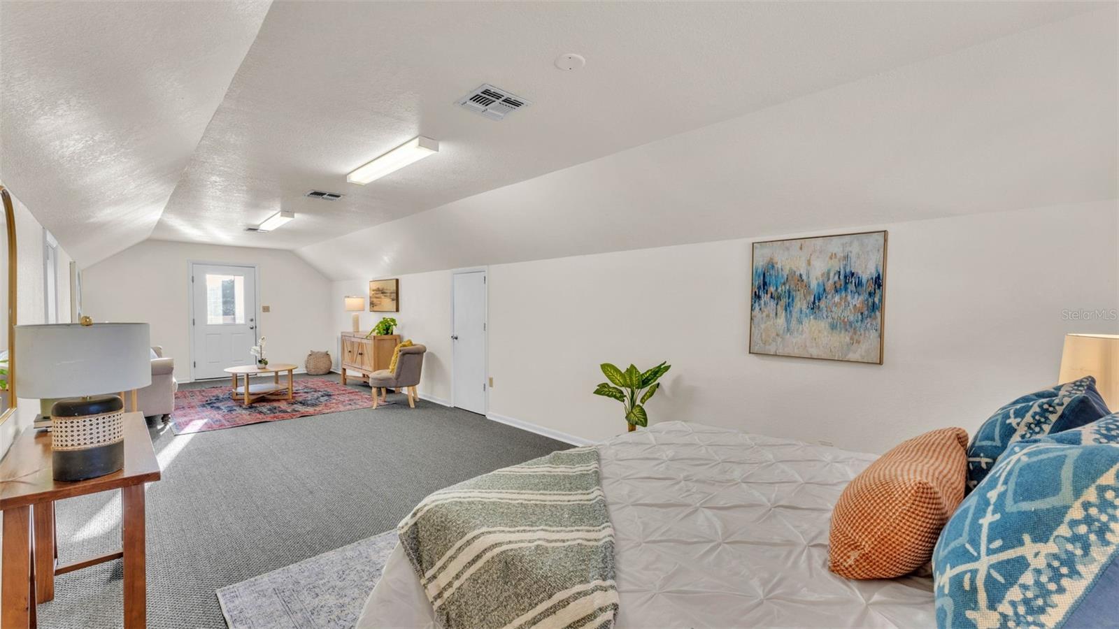 The substantial detached concrete block garage complete with an independent apartment—ideal for extended family, home based business, or rental potential. The building is huge and has two 12 foot garage doors, full electrical, plumbing, concrete slab floor, a metal roof, and is on its own electric meter. The spacious 12 x 36 bedroom suite is upstairs and spans the full length of the garage. Downstairs is a nice bathroom with a shower. There is also a washing machine hook-up.