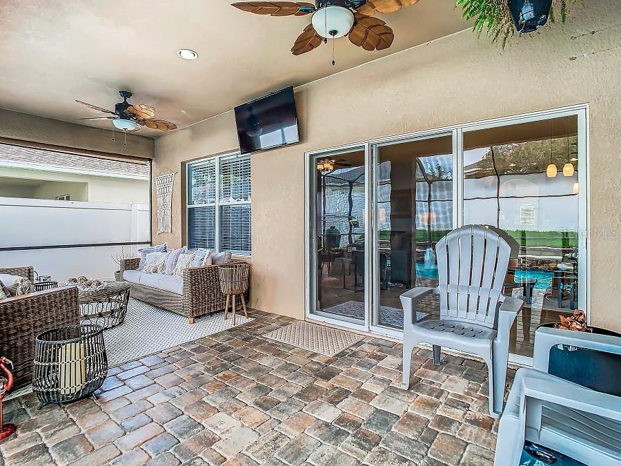 lanai with two ceiling fans and TV hookup