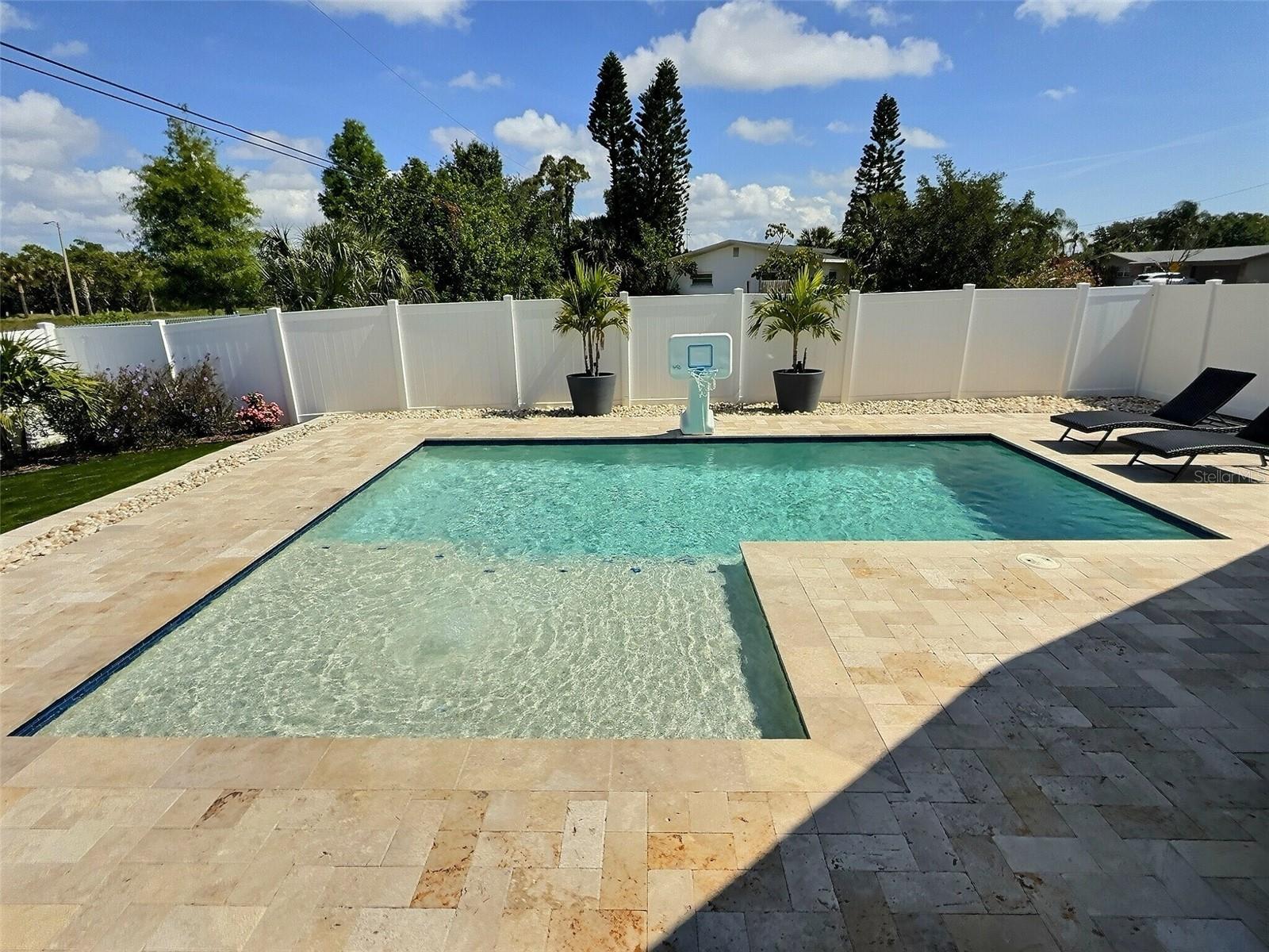 Beautiful saltwater pool with sunshelf and bubblers.