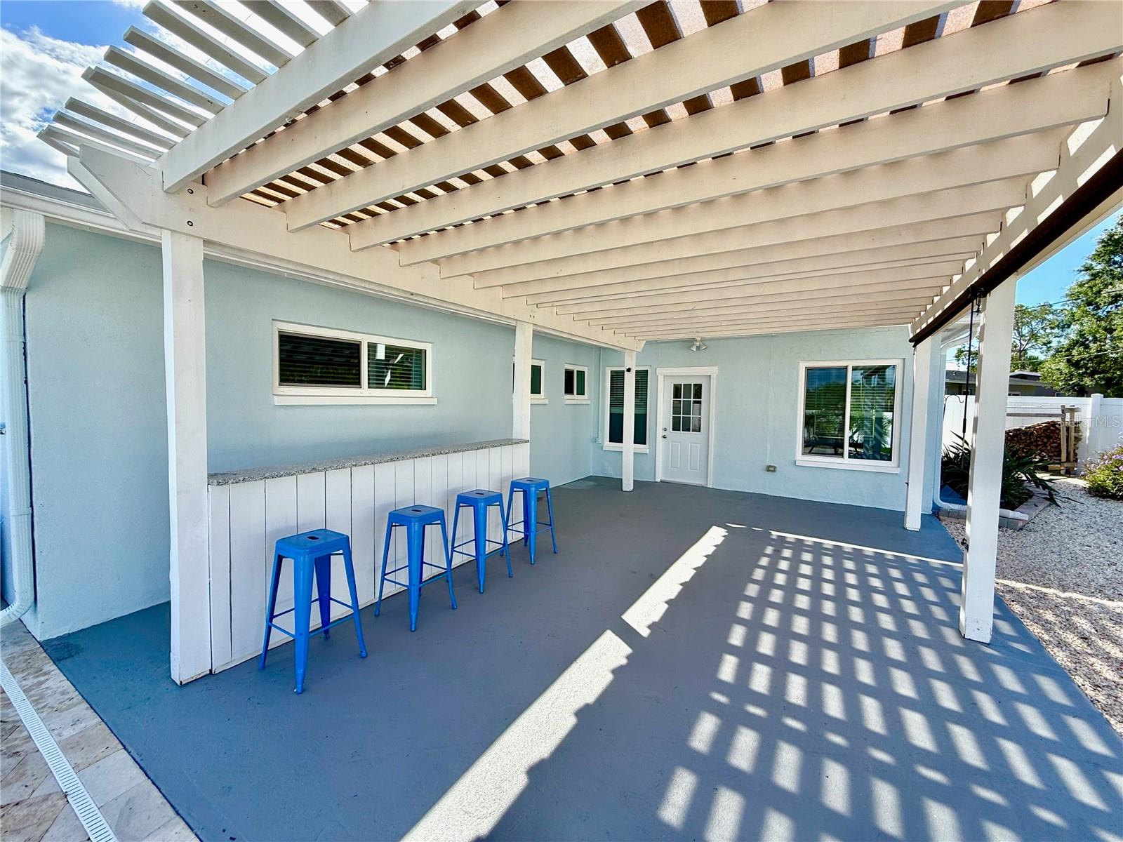 Pergola which leads to large family room