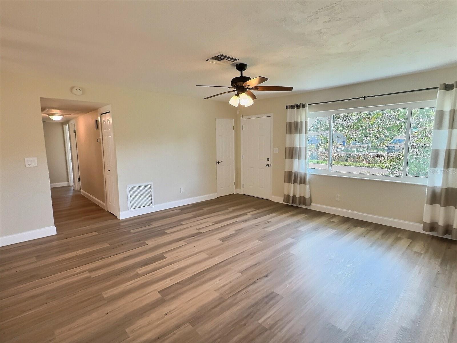 View from the kitchen looking towards front door and hallway to bedrooms.
