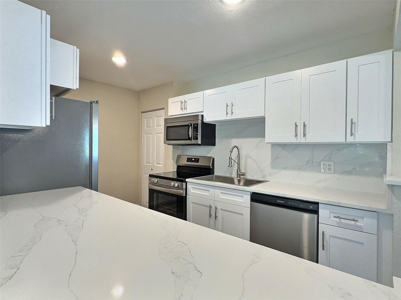 Freshly renovated kitchen with new appliances.