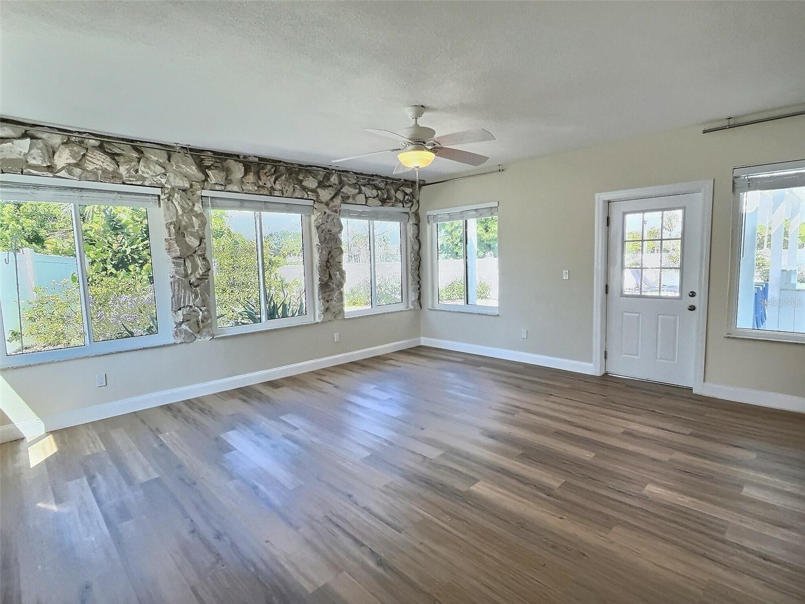 Family room with unique custom rock wall