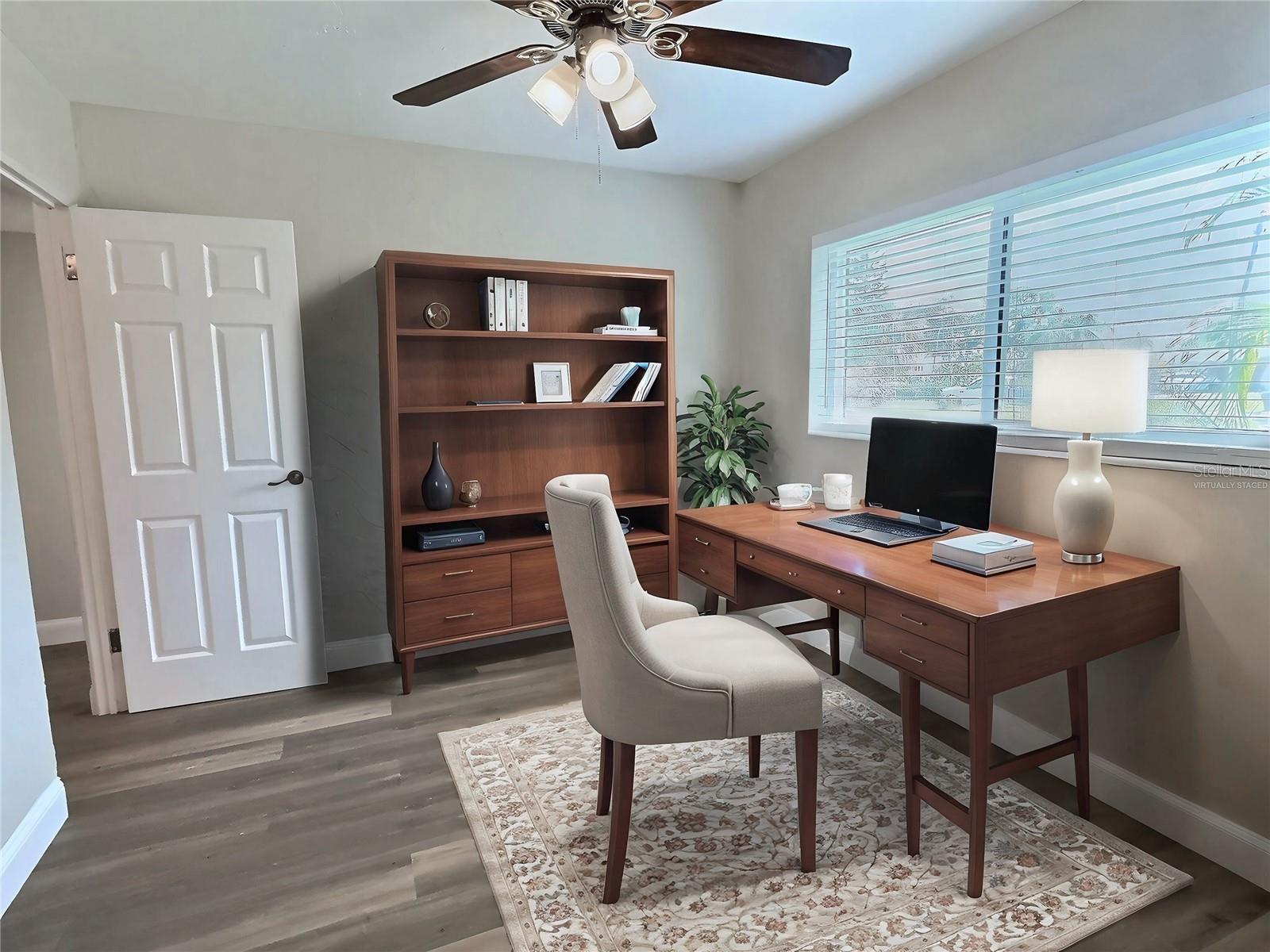 *VIRTUALLY STAGED* Bedroom 1 staged as an office.