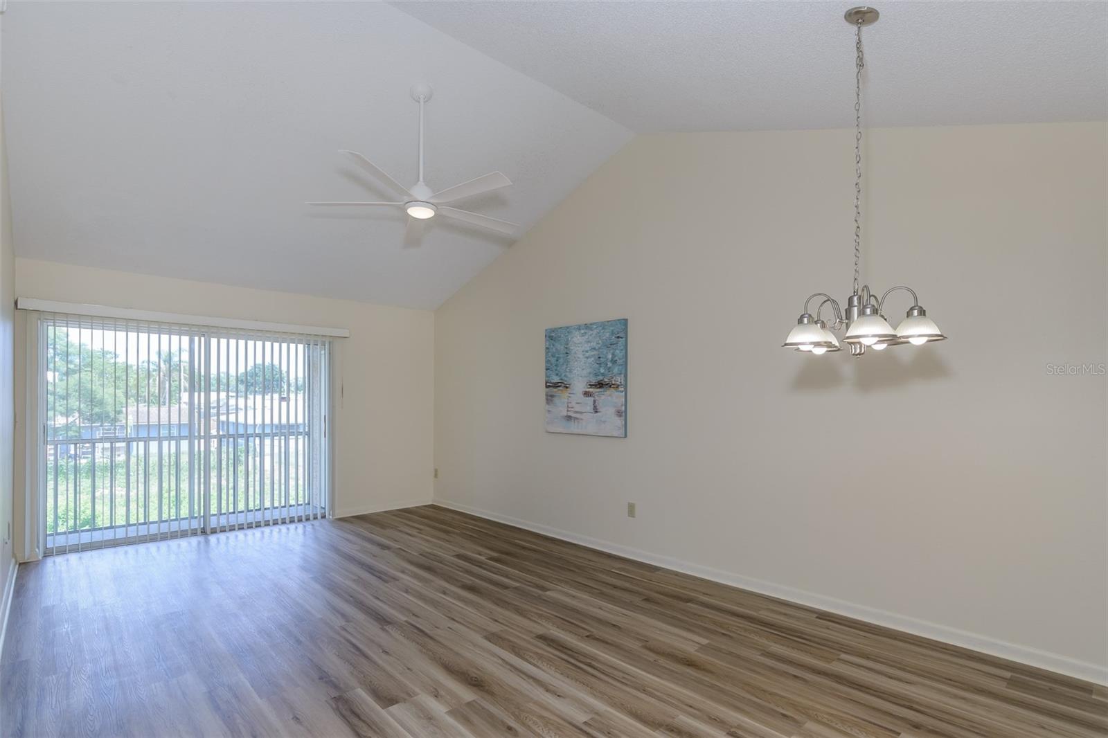 Very open floor plan with new flooring, freshly painted interior, and cathedral ceiling.
