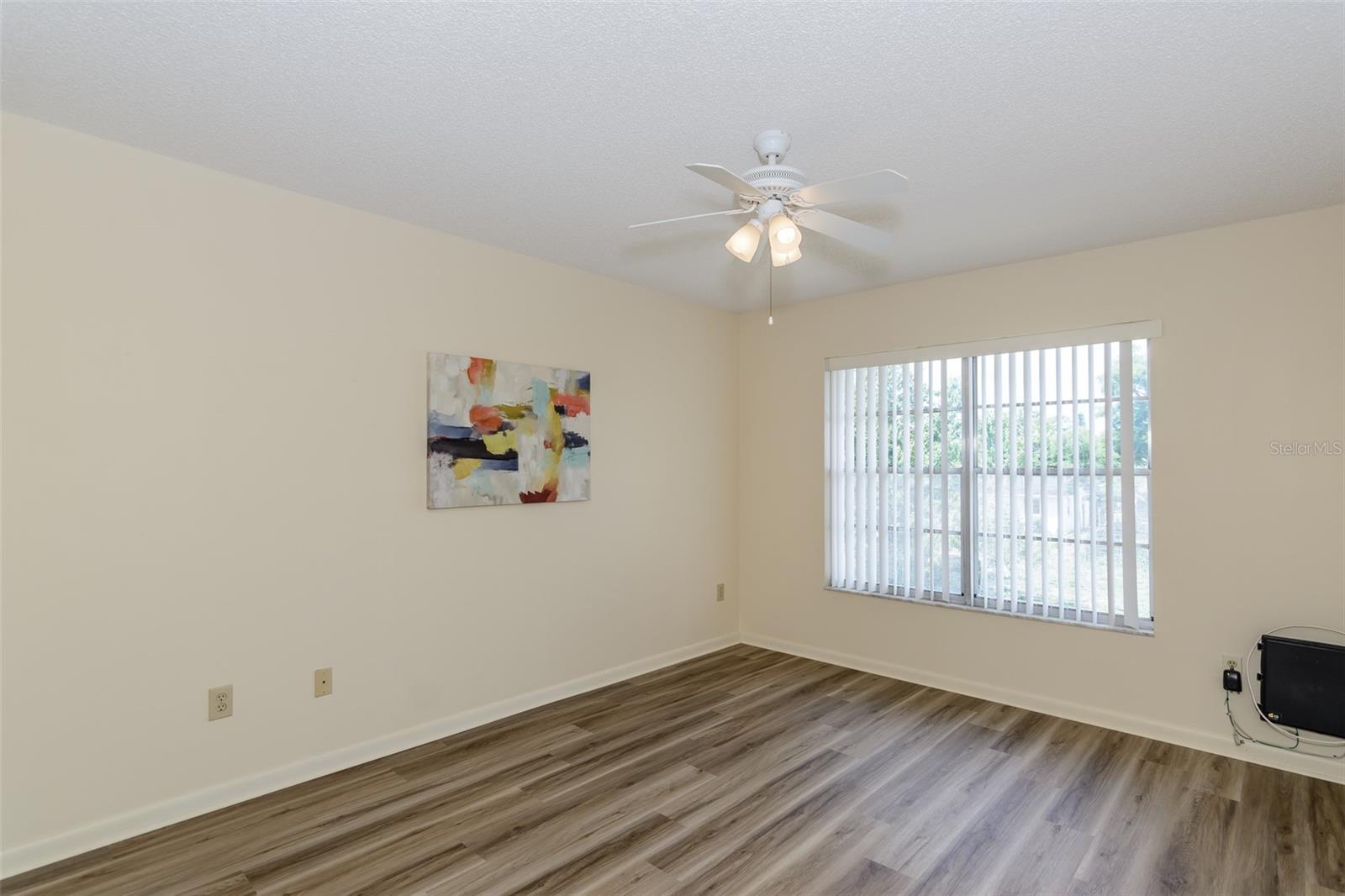 Primary bedroom with walk-in closet and ensuite bath.
