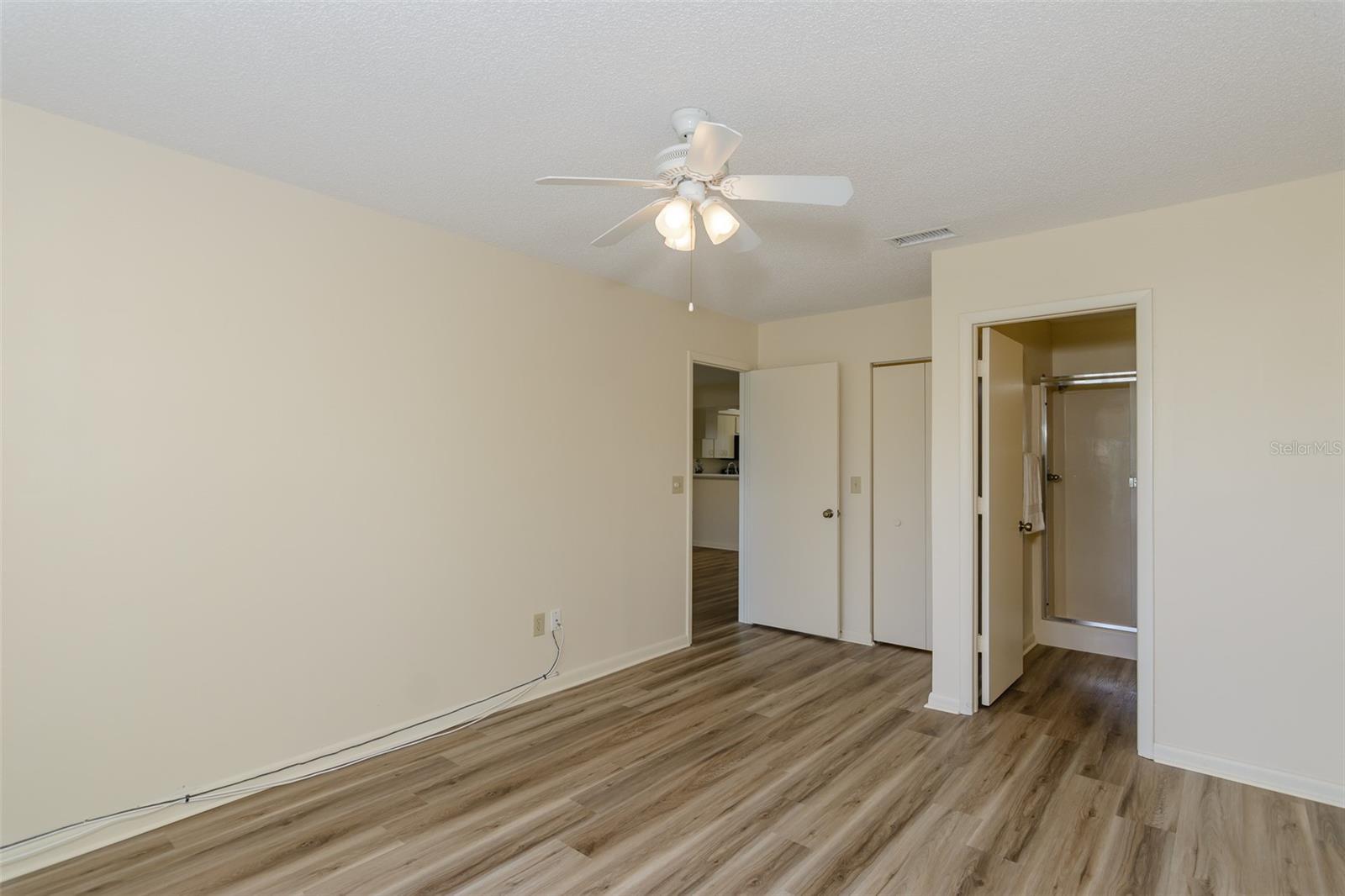 Walk-in closet by entrance and private bath.