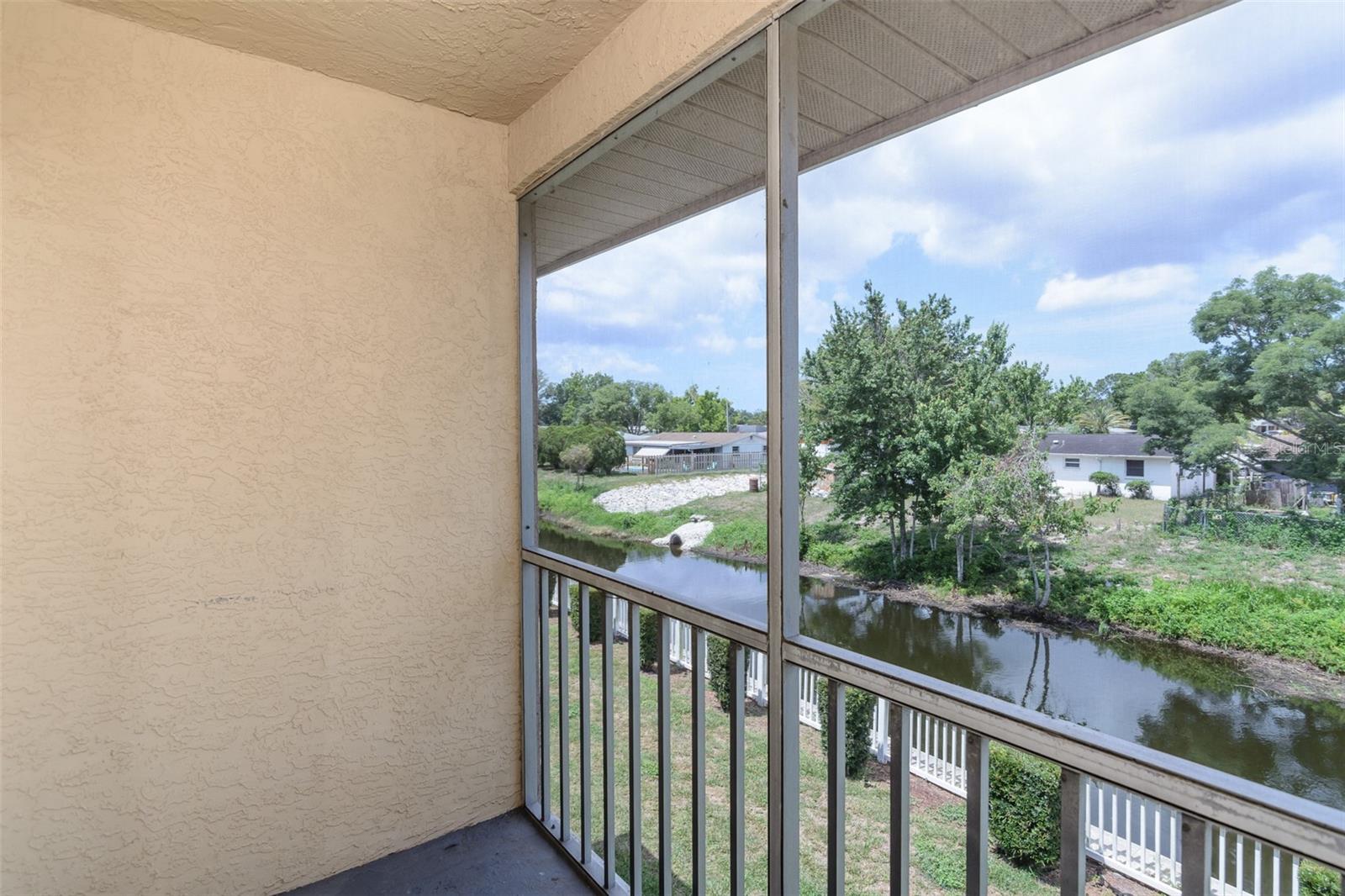 Balcony overlooks a canal.