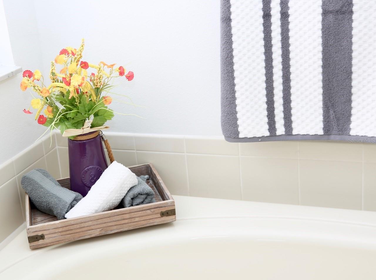 garden tub shelf in primary bathroom